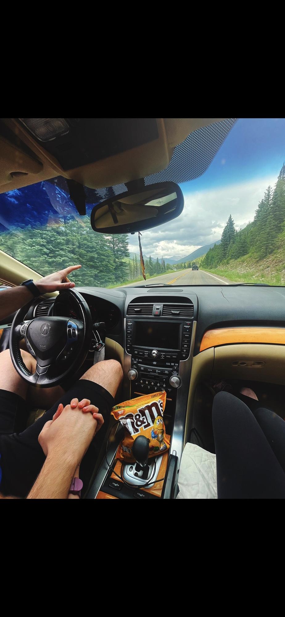 On a road trip pointing at the green mountains, of course! Can’t forget the peanut M&M’s!