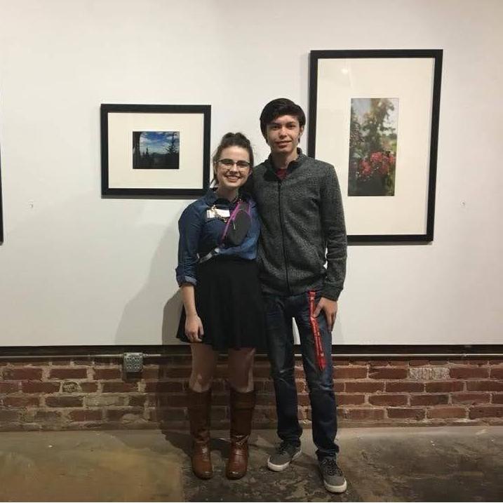The bride's first-ever art show her senior year of high school, back in 2018!