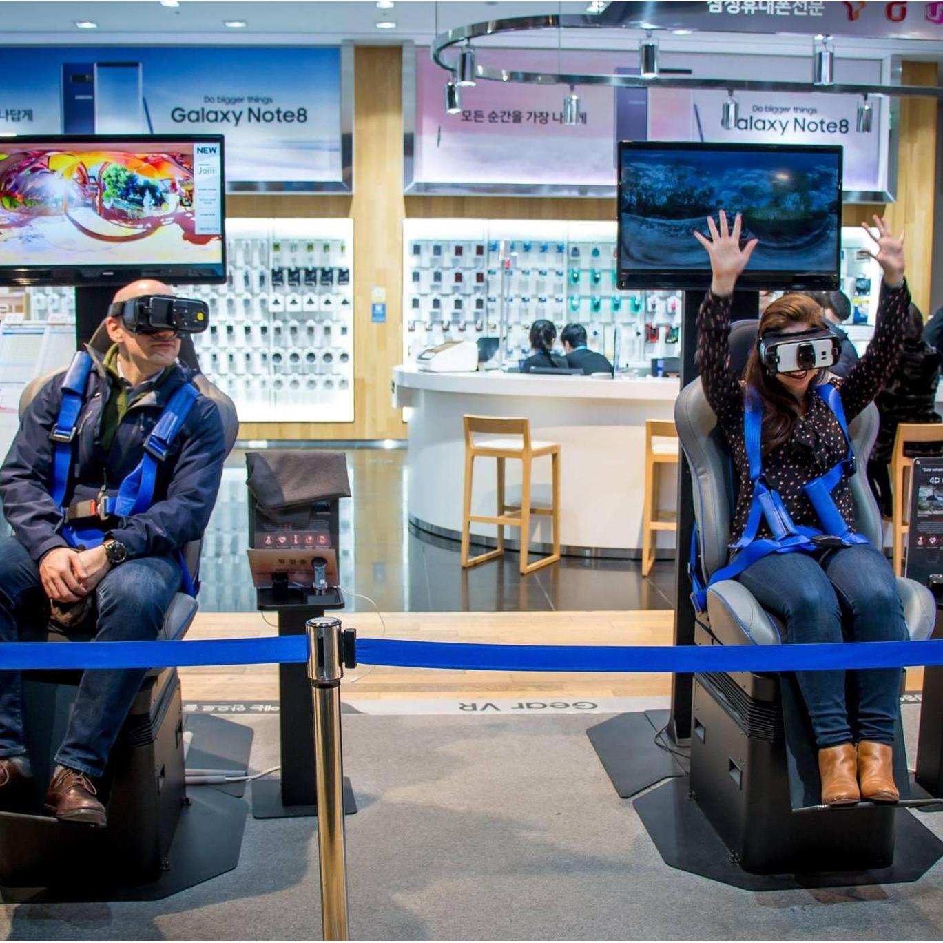 Trying out a virtual reality ride in Seoul. Some of us show our enthusiasm for tech more than others (hint: it's not the tech CEO)