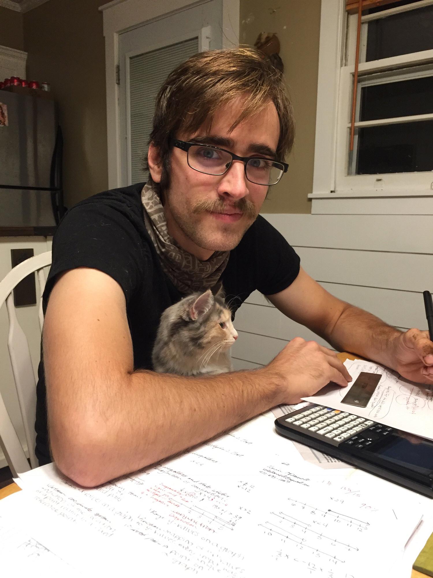Kevin snugglin with his newest favorite girl, Fermat