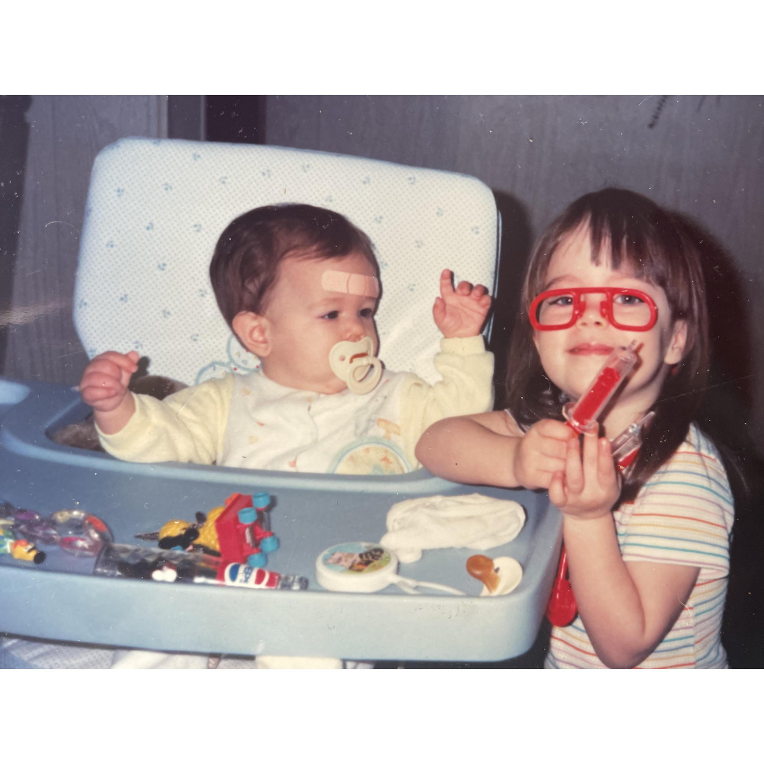 Kayla loved to "doctor" her baby sister growing up.