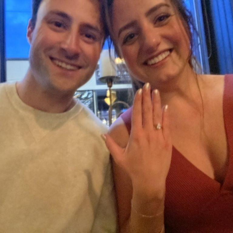 The photo we sent letting people know we'd gotten engaged after getting caught in the rain and wind