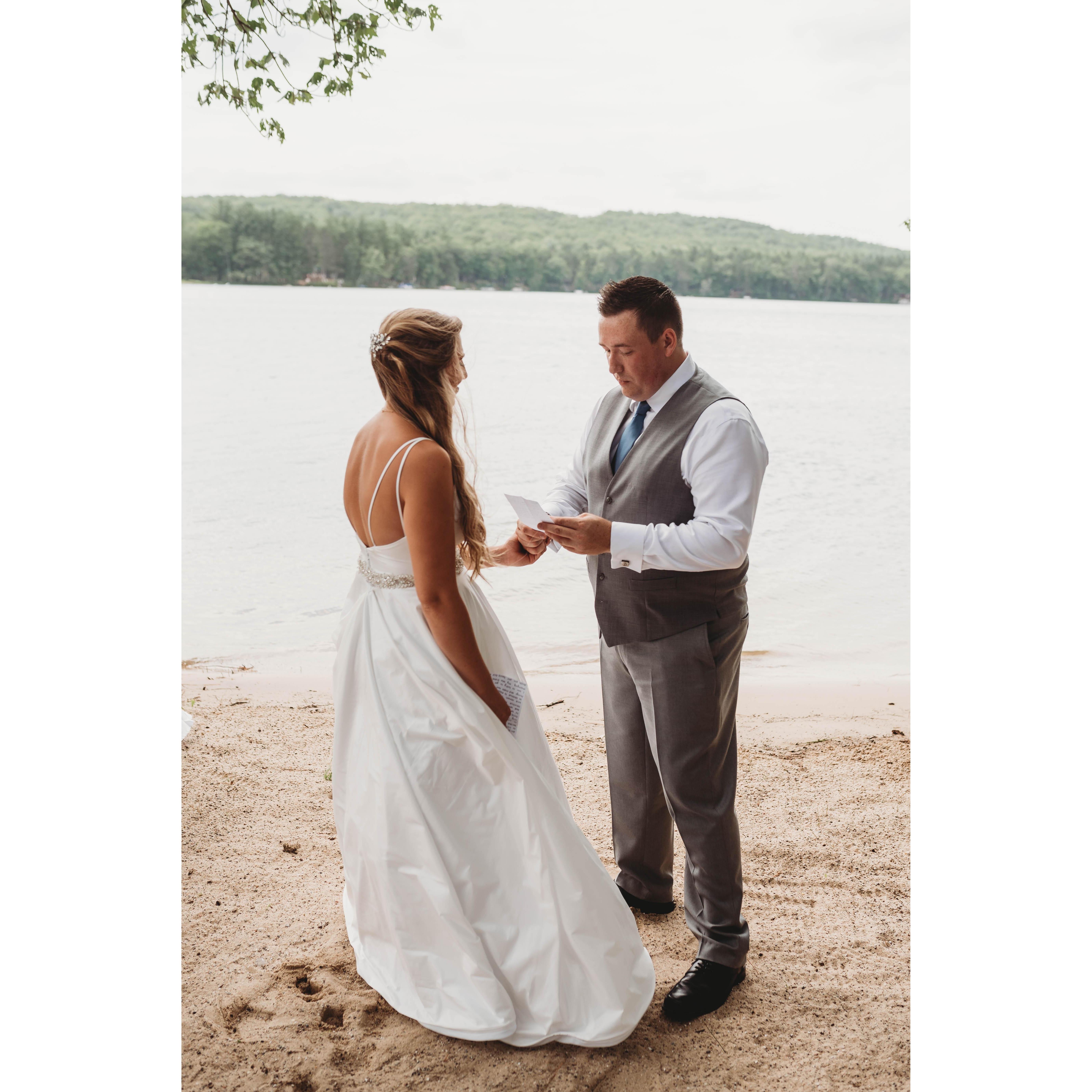 The bride and groom sharing their own vows just the two of them before the wedding.