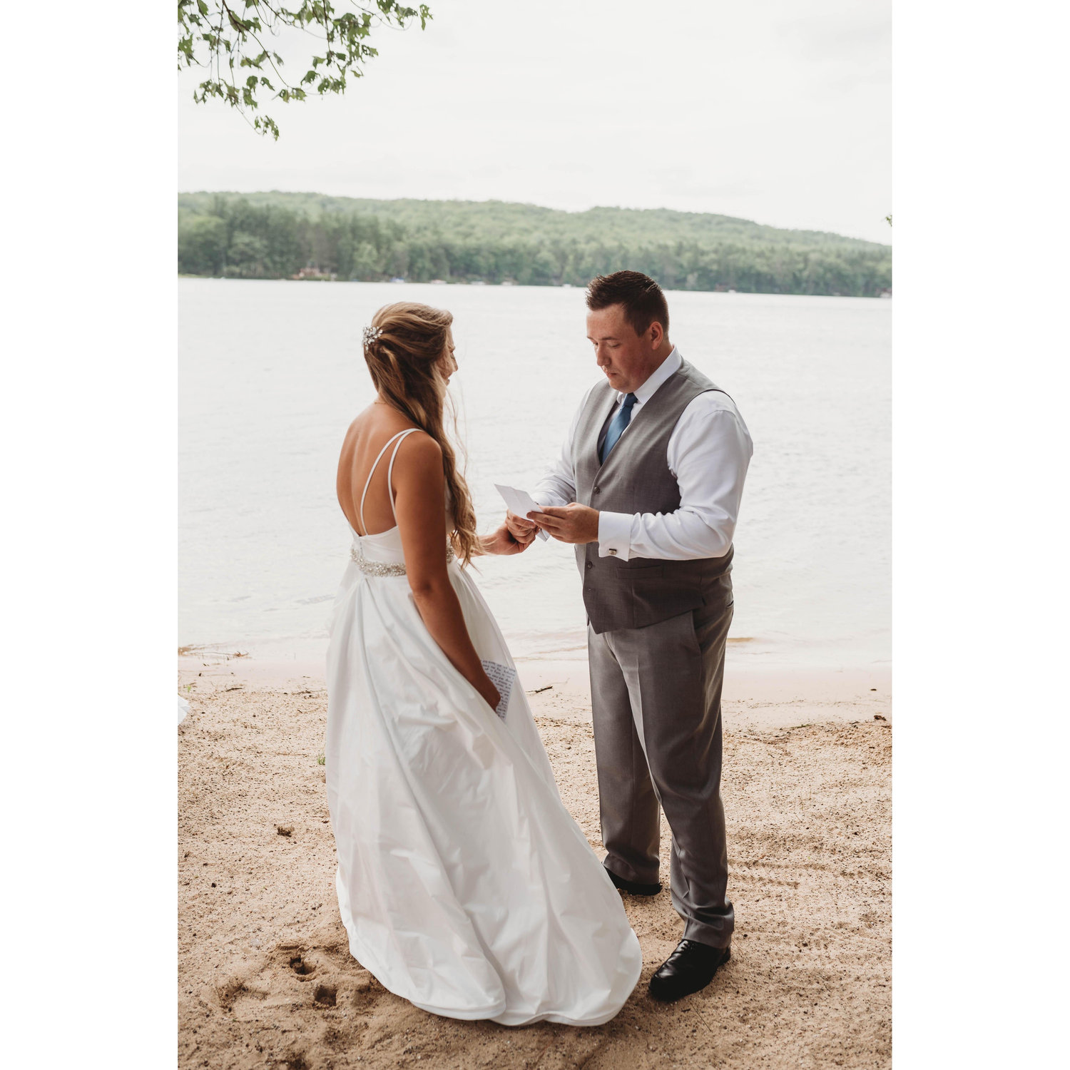 The bride and groom sharing their own vows just the two of them before the wedding.