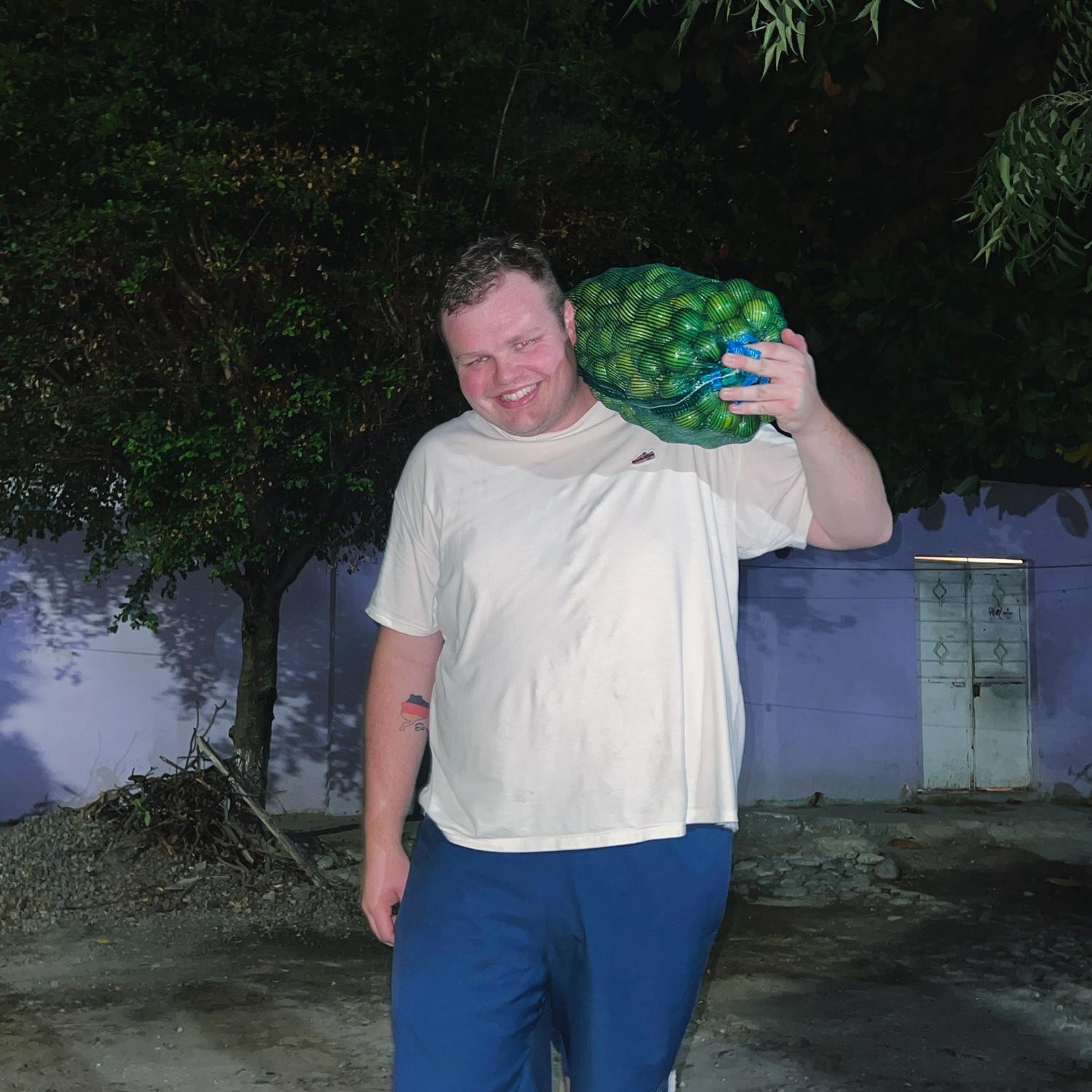 Henry carrying a sack of limes in Mexico