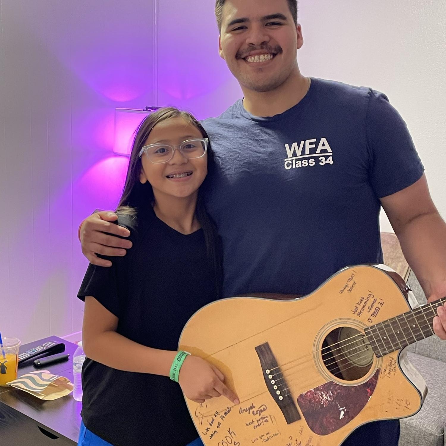 Amayah (Liz's niece) loved X and would ask more for him and for Liz. She signed his guitar :)