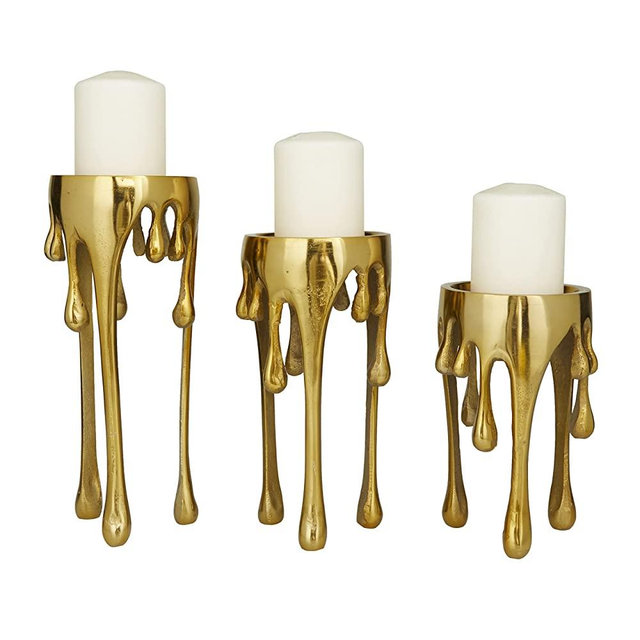 CosmoLiving by Cosmopolitan Aluminum Pillar Candle Holder with Dripping Melting Designed Legs, Set of 3 12", 10", 8"H, Gold