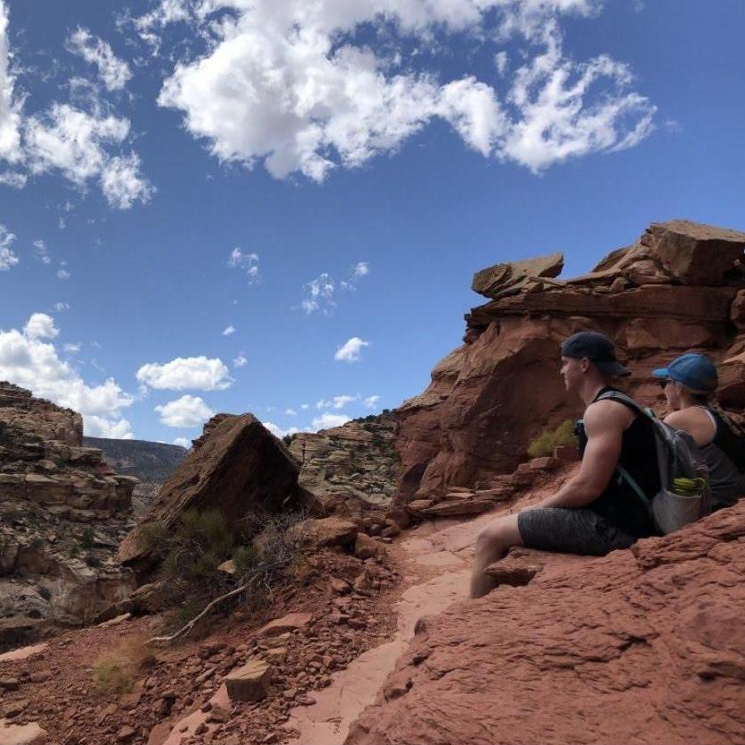 Capitol Reef National Park, Navajo Knobs trail while visiting Sarah's Brother and Sister in law. Neither of them believed she could climb any of the rock features.