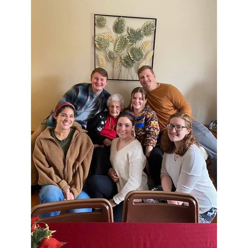 A group photo with the cousins around Gram during Christmas