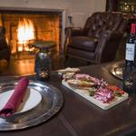 Sip on a cocktail by the fire or on the covered outdoor porch at Red Lion Inn