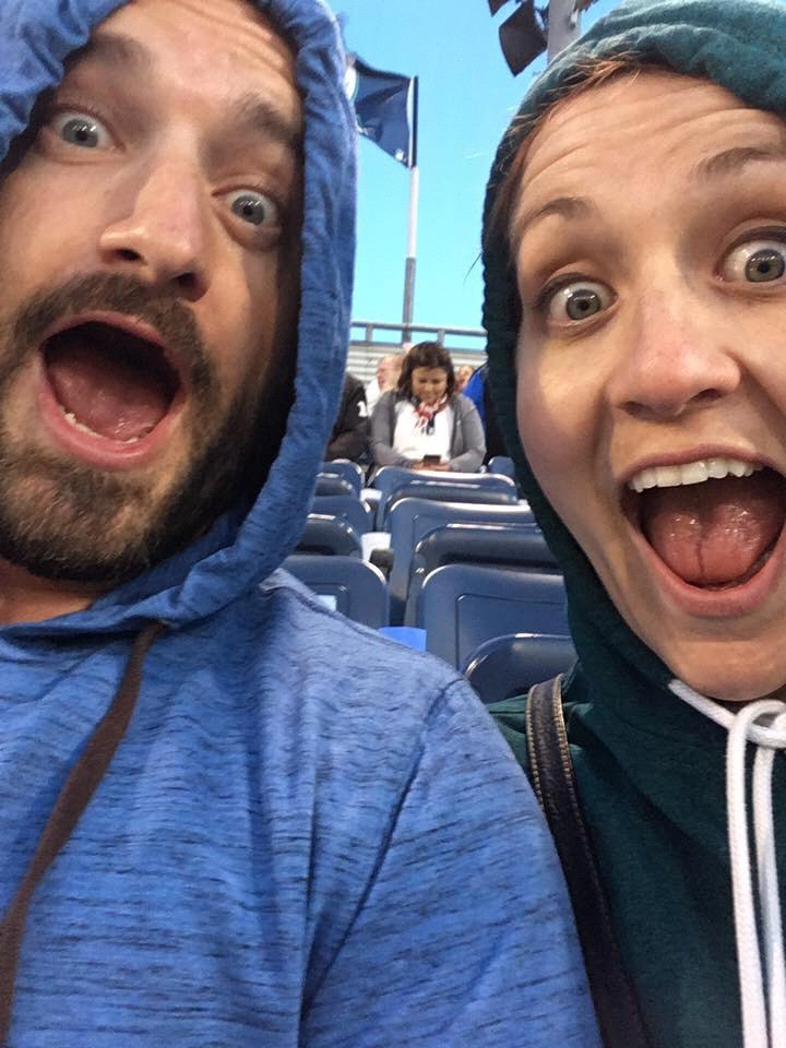 Trying to keep warm during a baseball game while on tour.