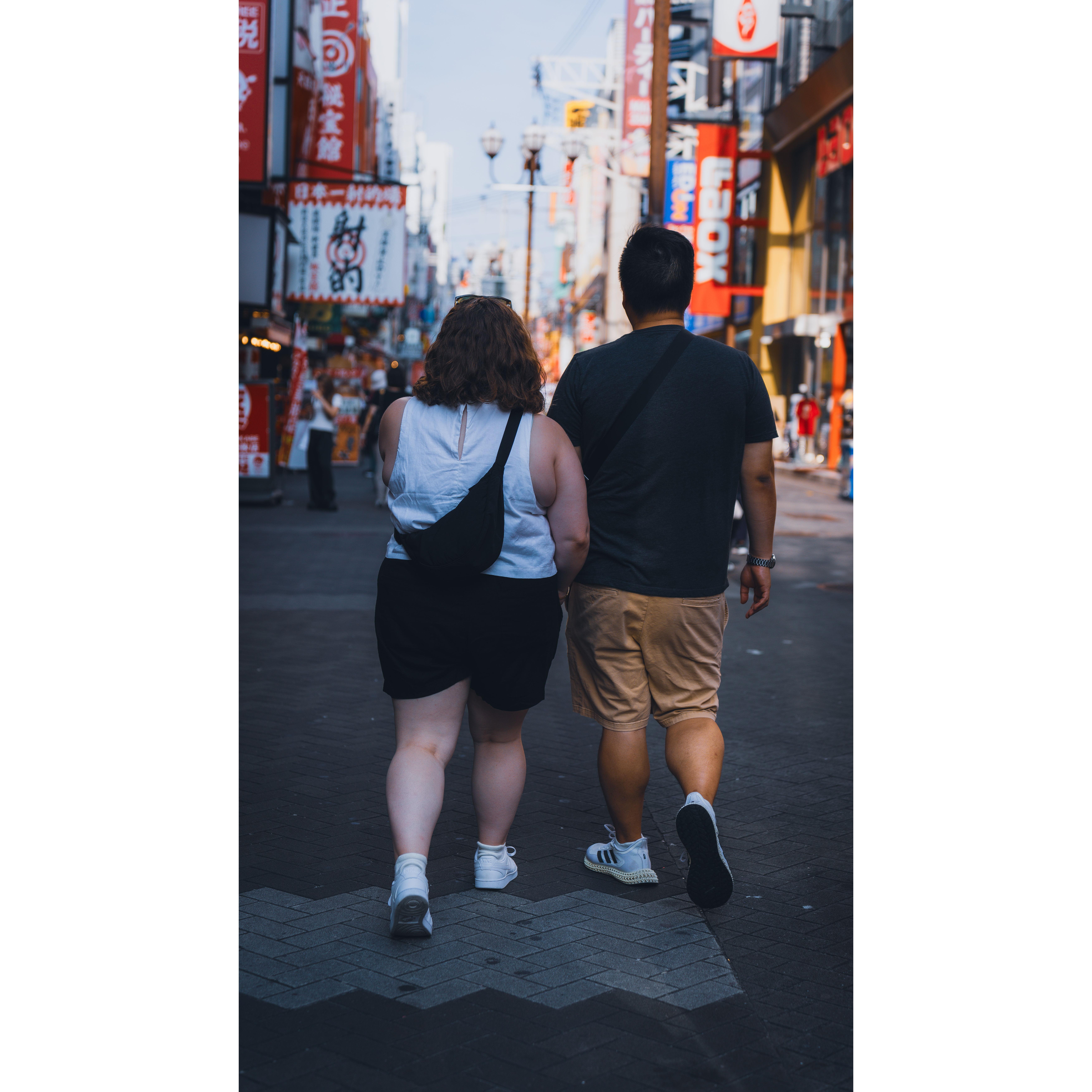 Walking together in Dotombori