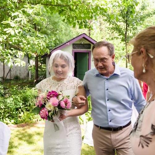Hilary's father (Jim) walking her down the isle.