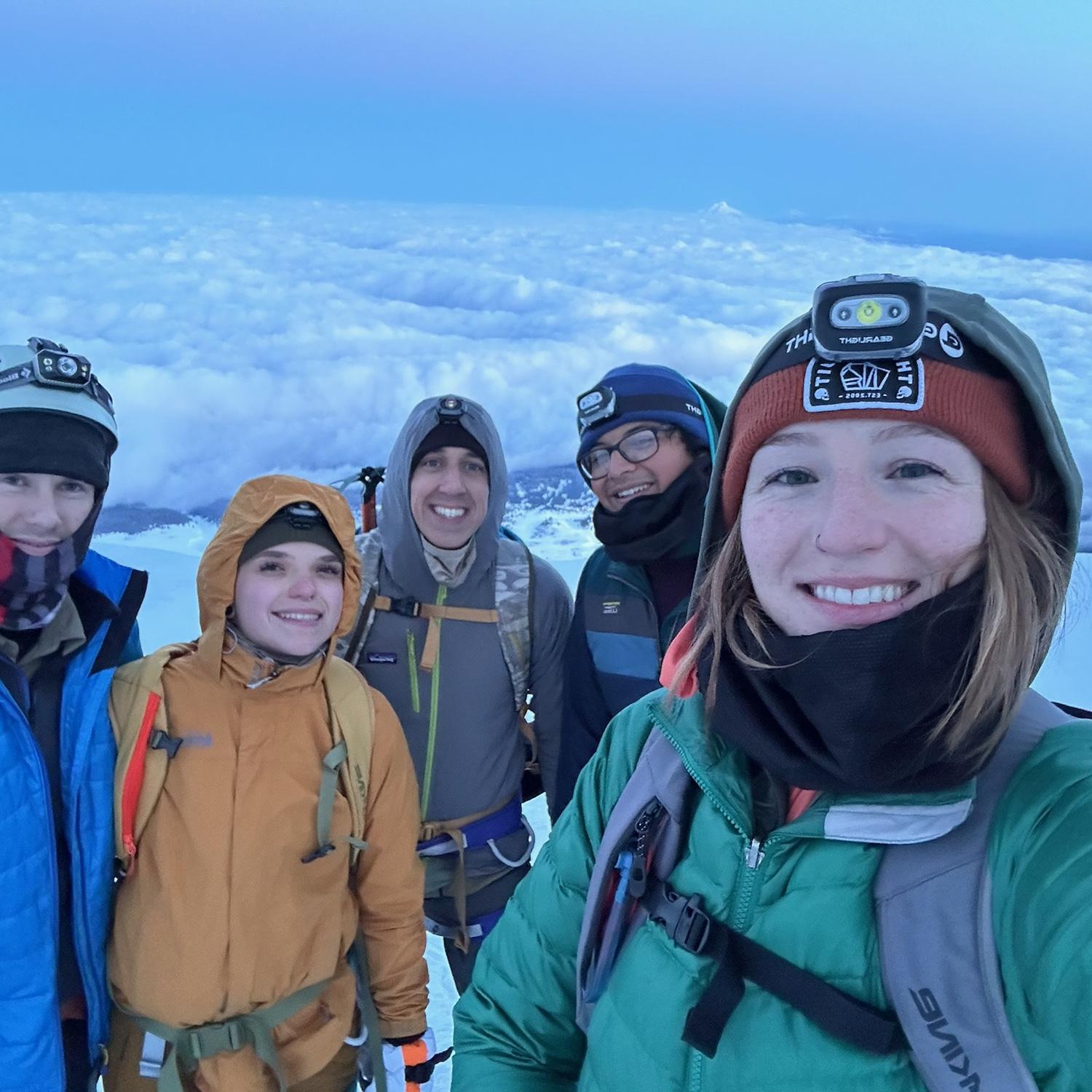 Our officiant takes a group selfie while at Devil's Kitchen. We were incredibly happy to see the  rising sun!