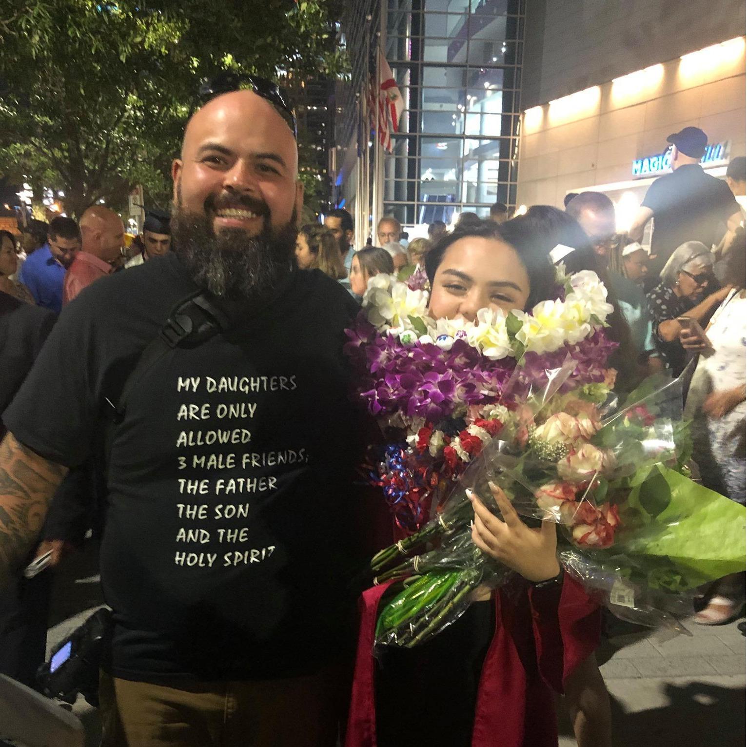 Dominique and her dad at Dominique's graduation.