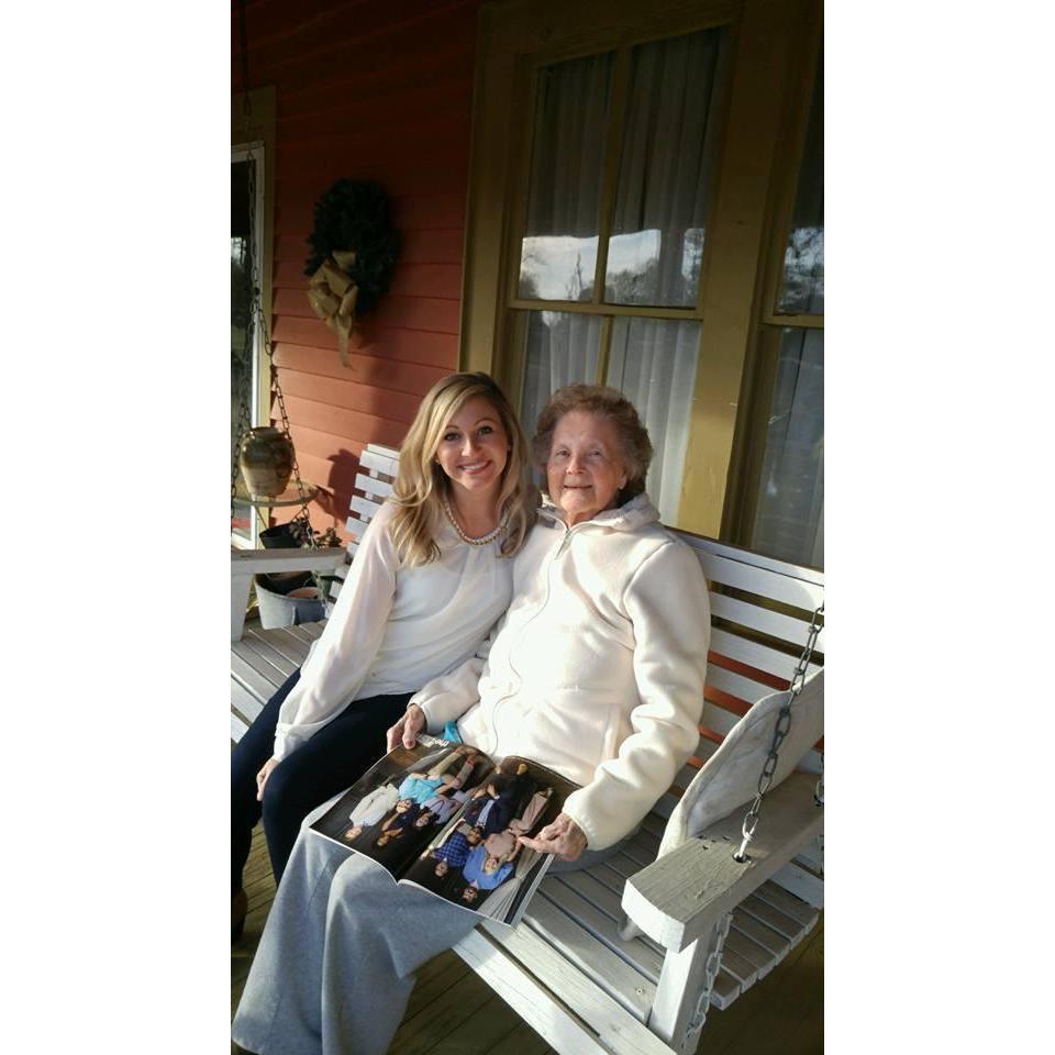 Brit showing her Nana how she was featured in a magazine. They love to swing together.