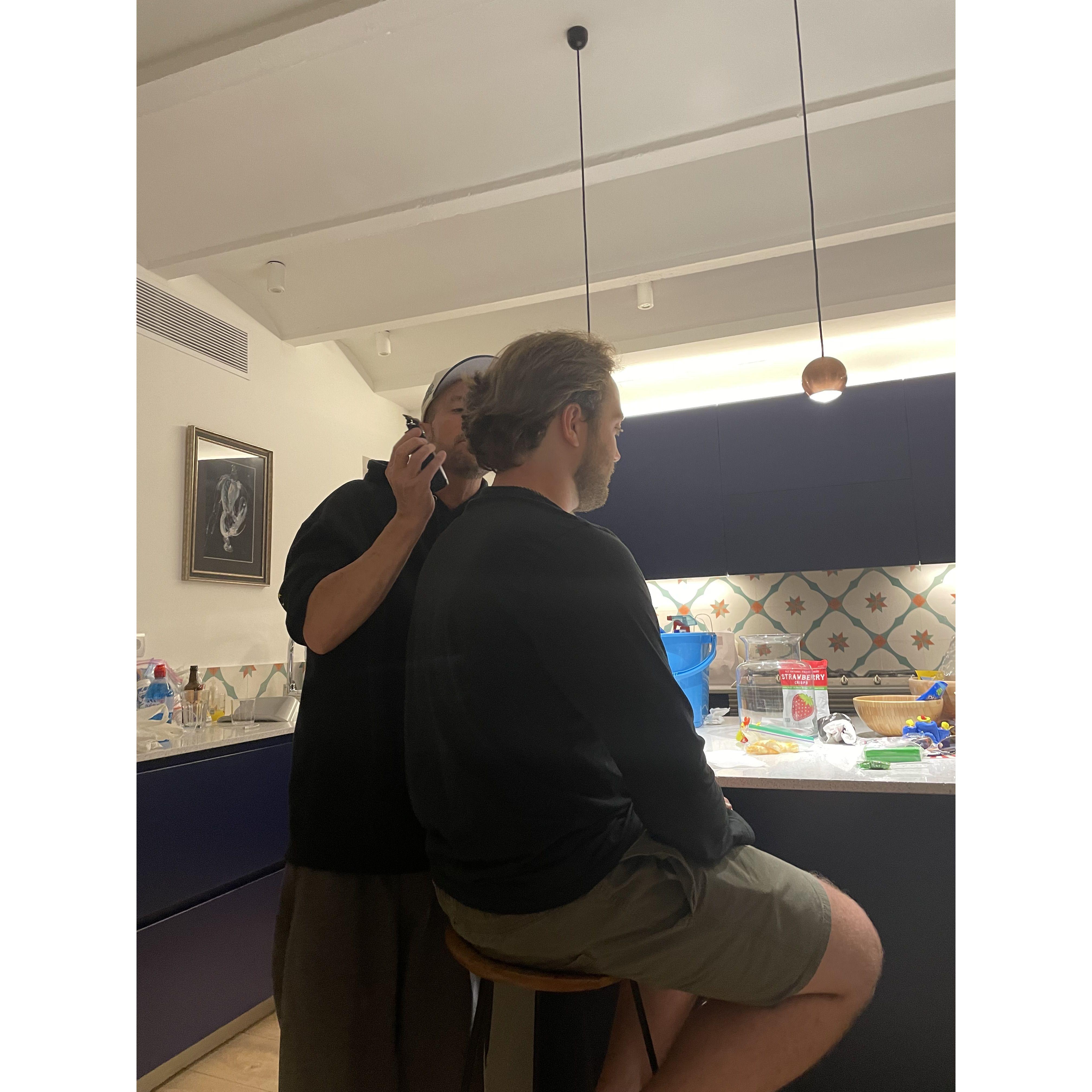 uncle Ryan cutting adam's hair