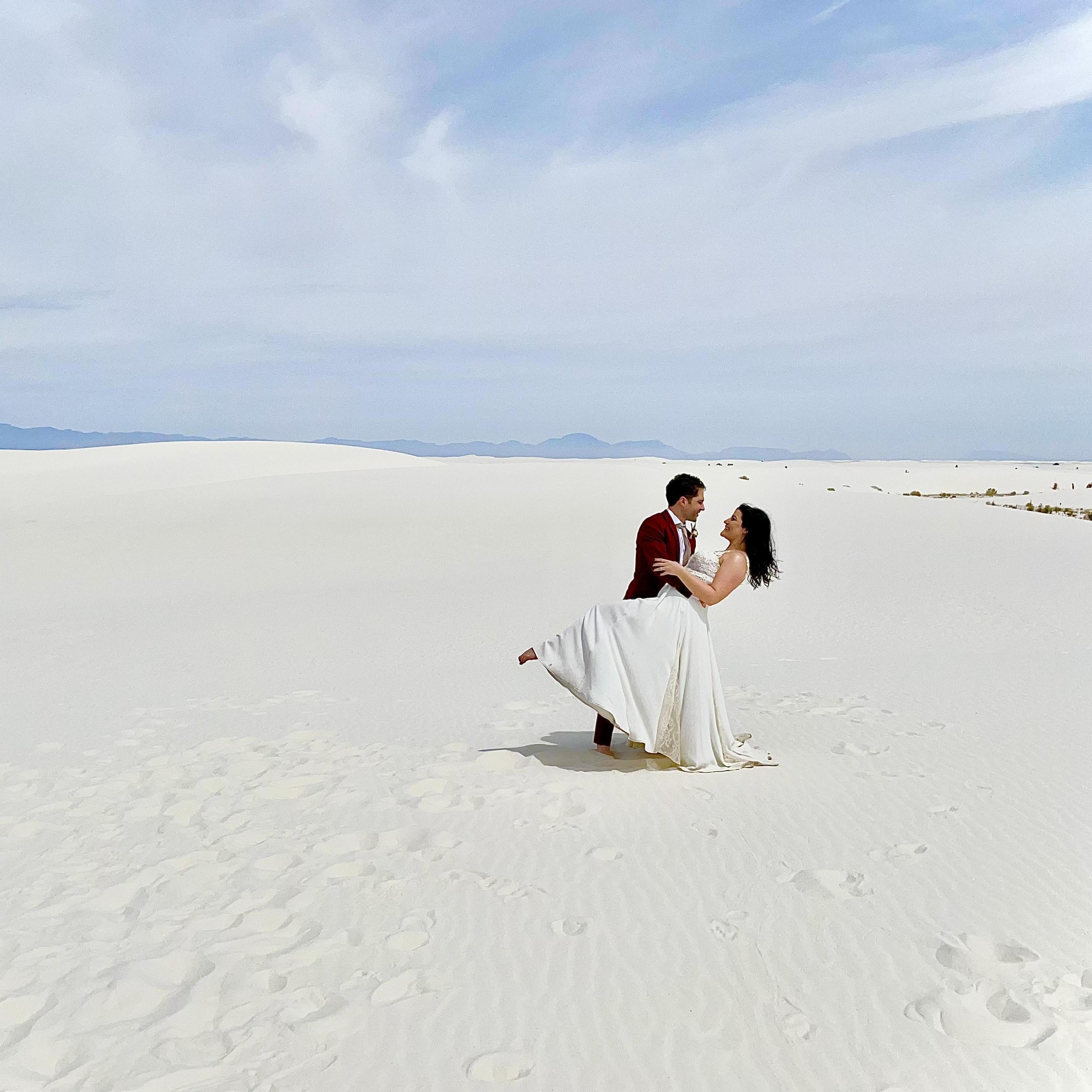 At White Sands National Park. Now, here's a fun story: while taking photos ourselves, we were randomly approached by a wedding photographer who was also at the park.