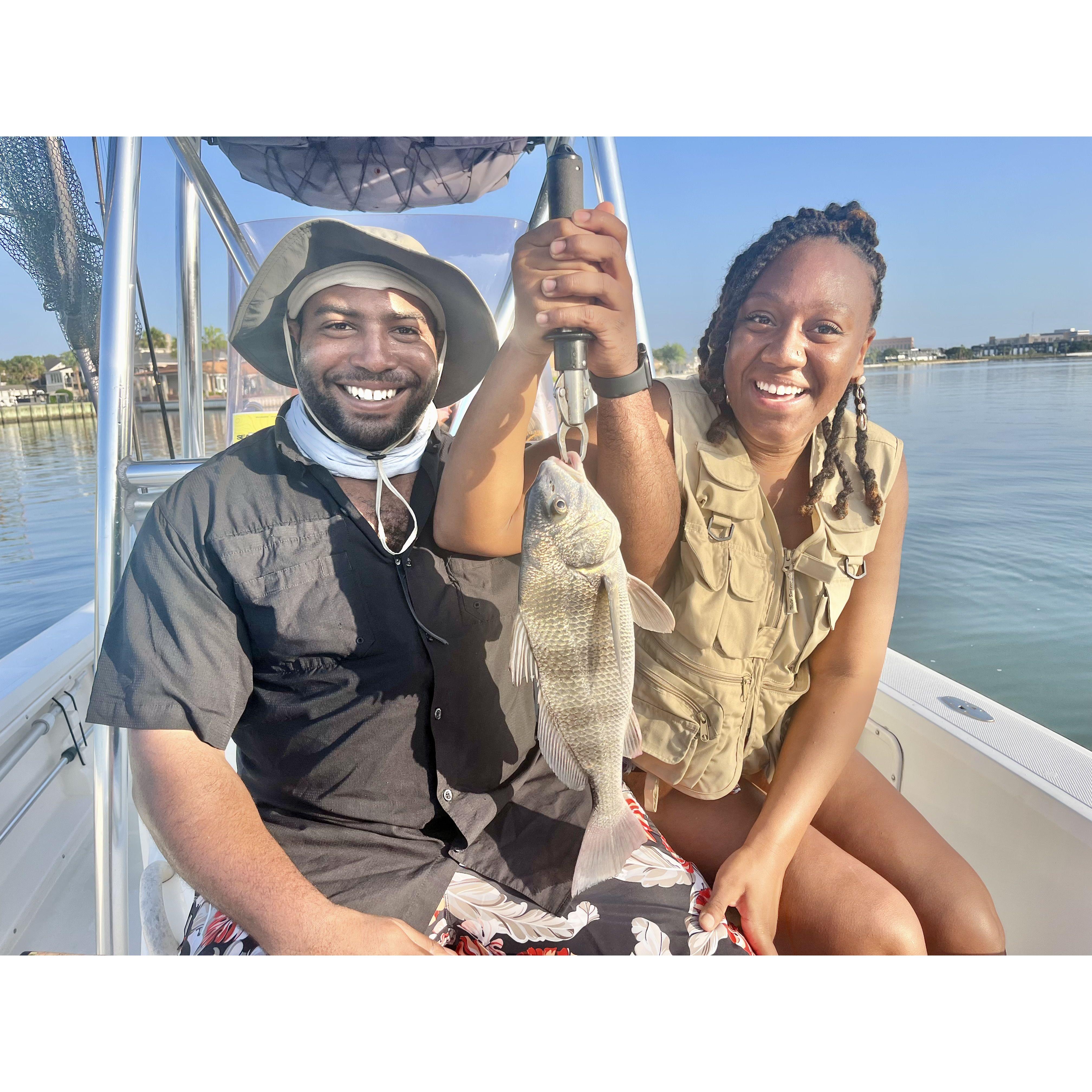 Kris teaching Kadeeja how to fish