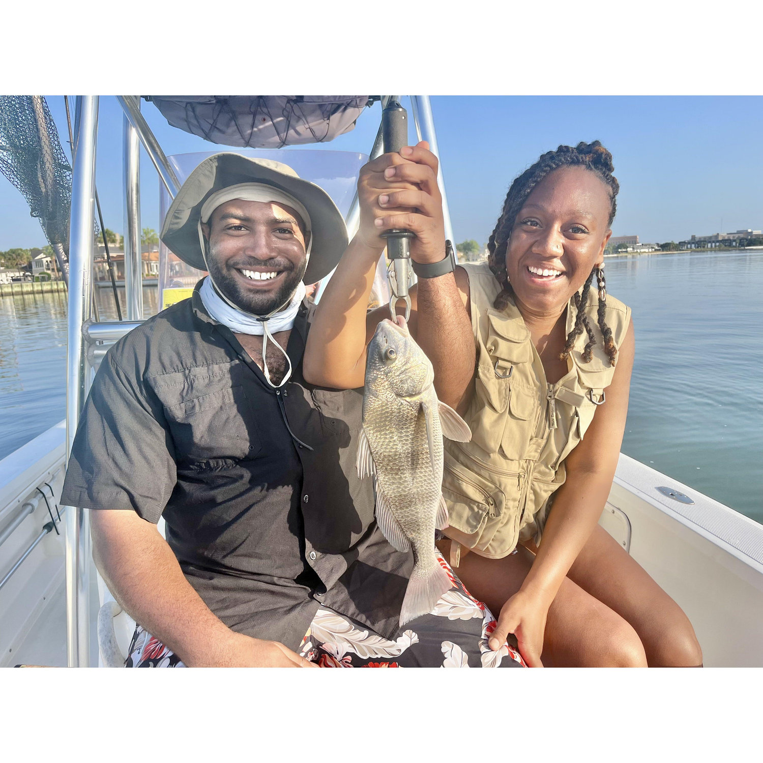 Kris teaching Kadeeja how to fish