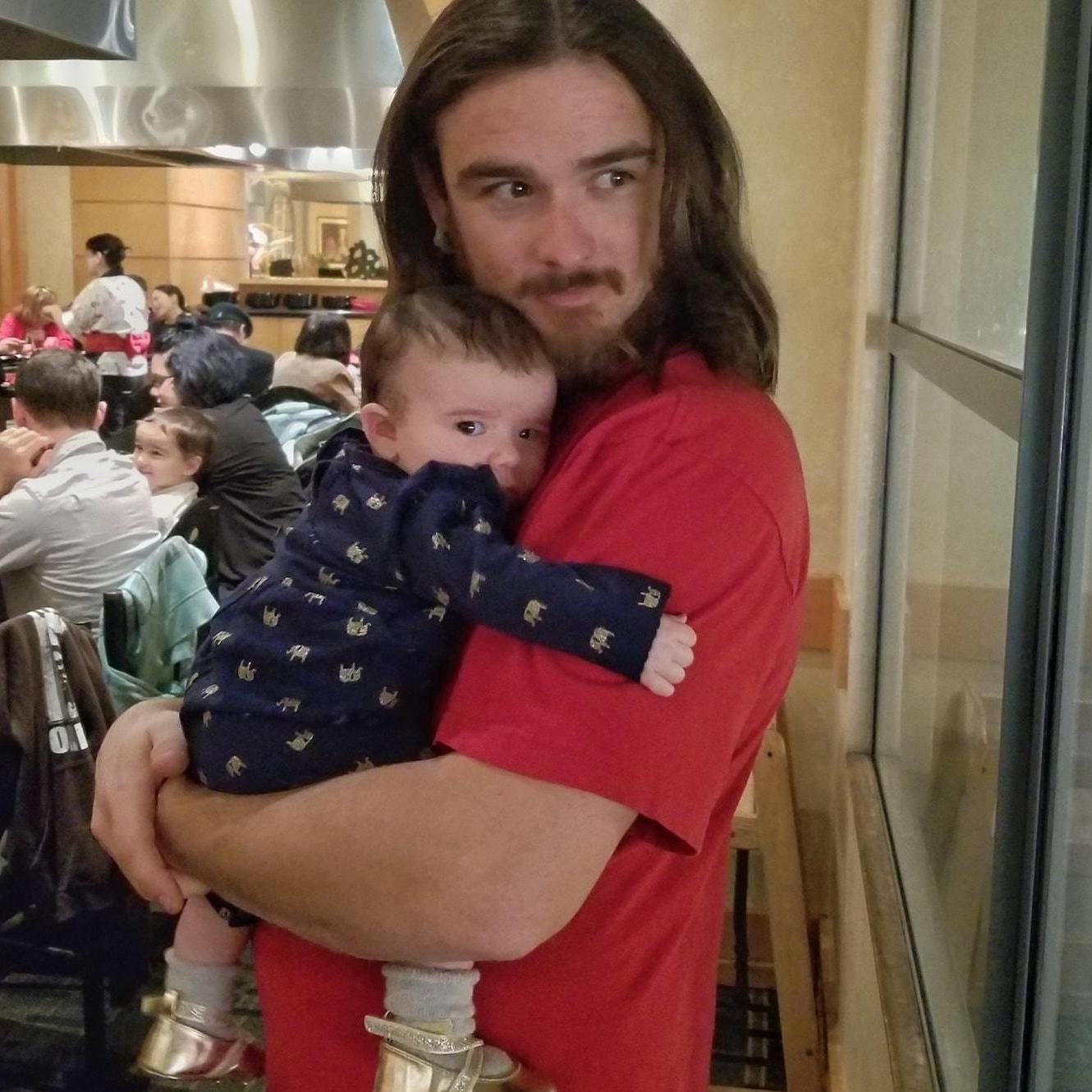 When you know you have Daddy wrapped around your little finger. Photo courtesy of Steven Widney.