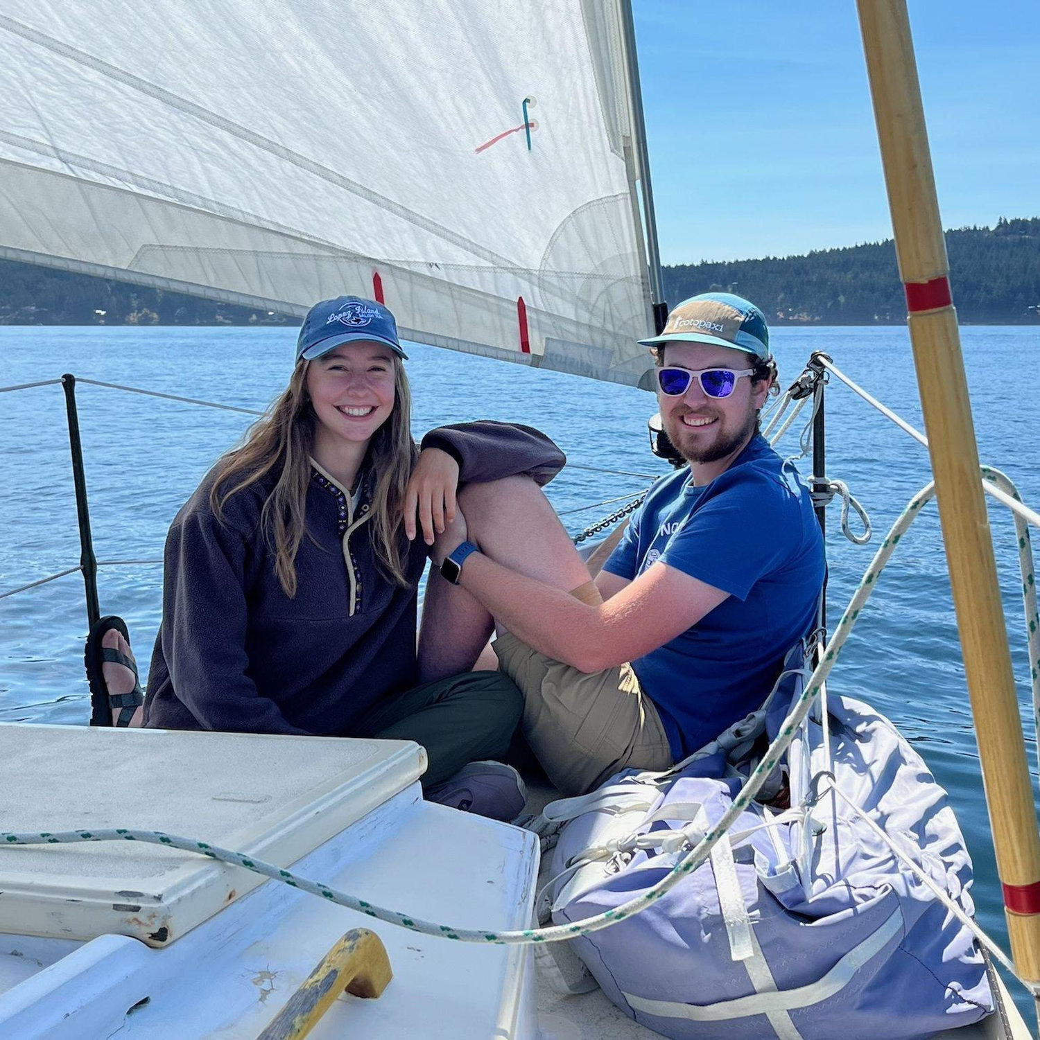 Maia and Henry on a sailboat close to Orcas Island.