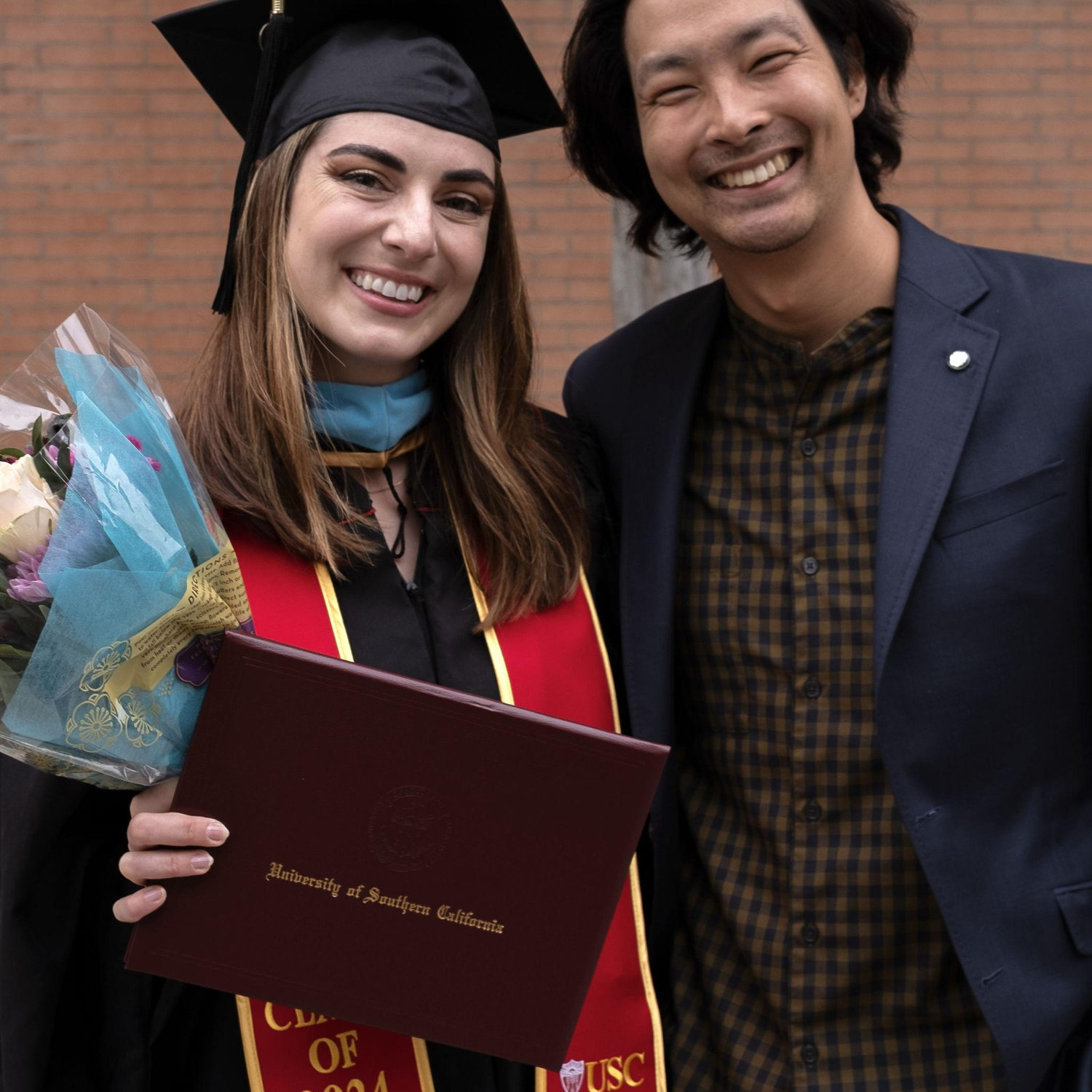 Bryce at Sarah's 2024 Master's in Marriage and Famiy Therapy graduation ceremony at USC.