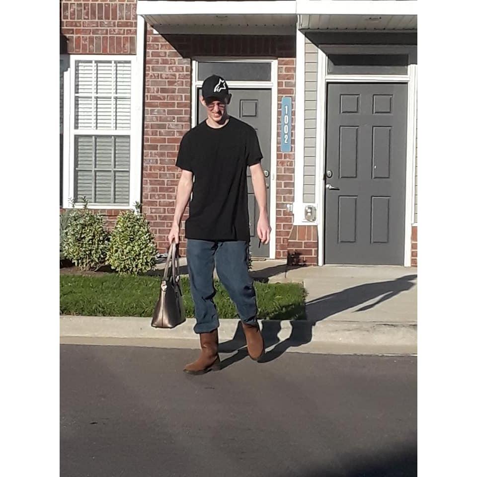 Michael looking sexy with his purse