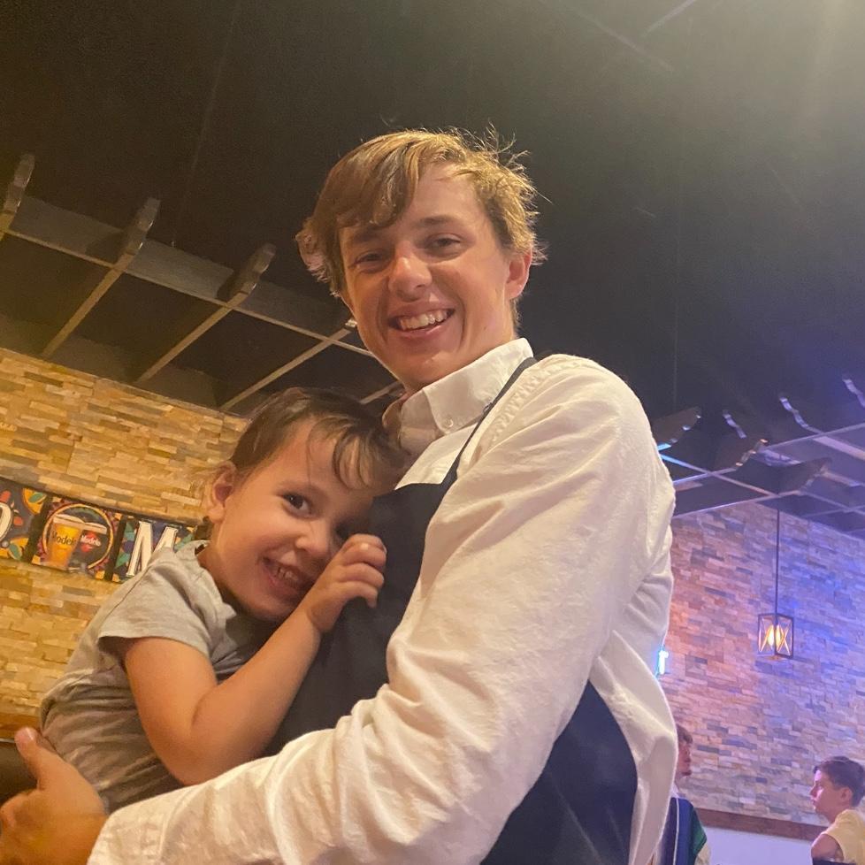 Charley loved visiting Carter at work-  but mostly for the chips and queso!