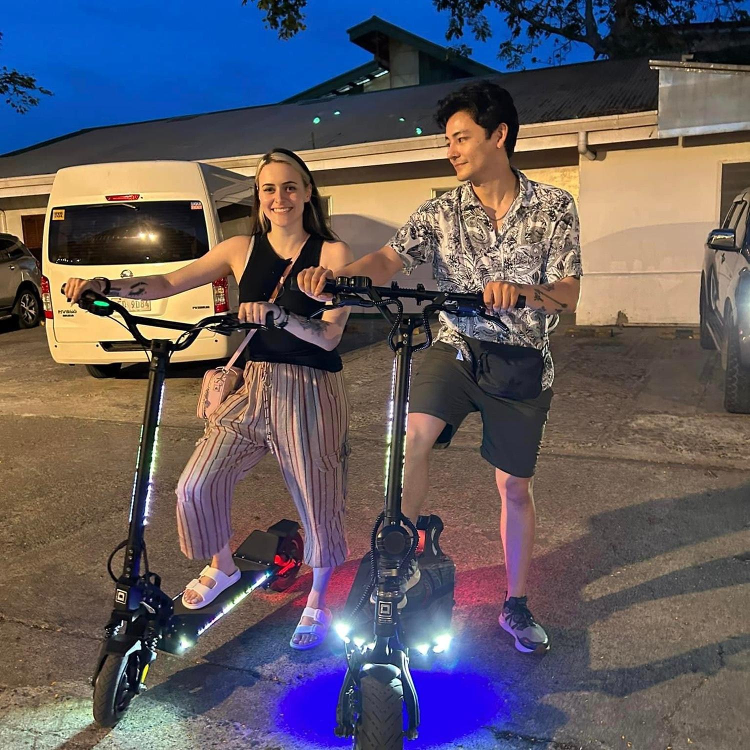 Exploring on scooters in Ilo Ilo city. Brian lovingly stares at Rina while she serves for the photo.