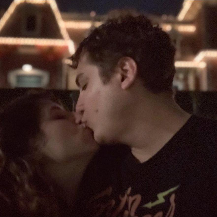 Taken on the last night of our trip for our engagement. In front of the Disneyland train station.