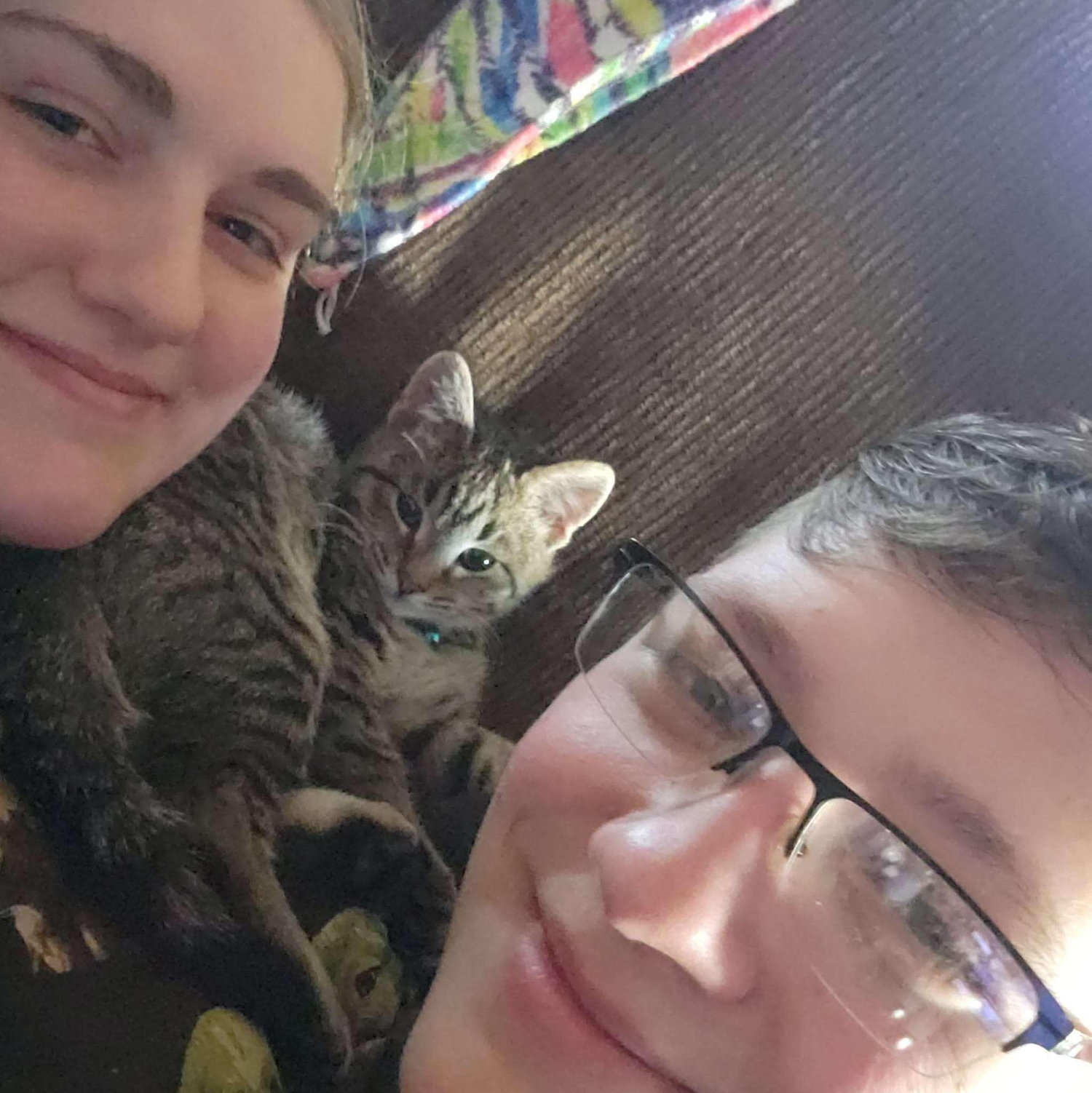 Us in our new house with our kitten Jackie March 2025