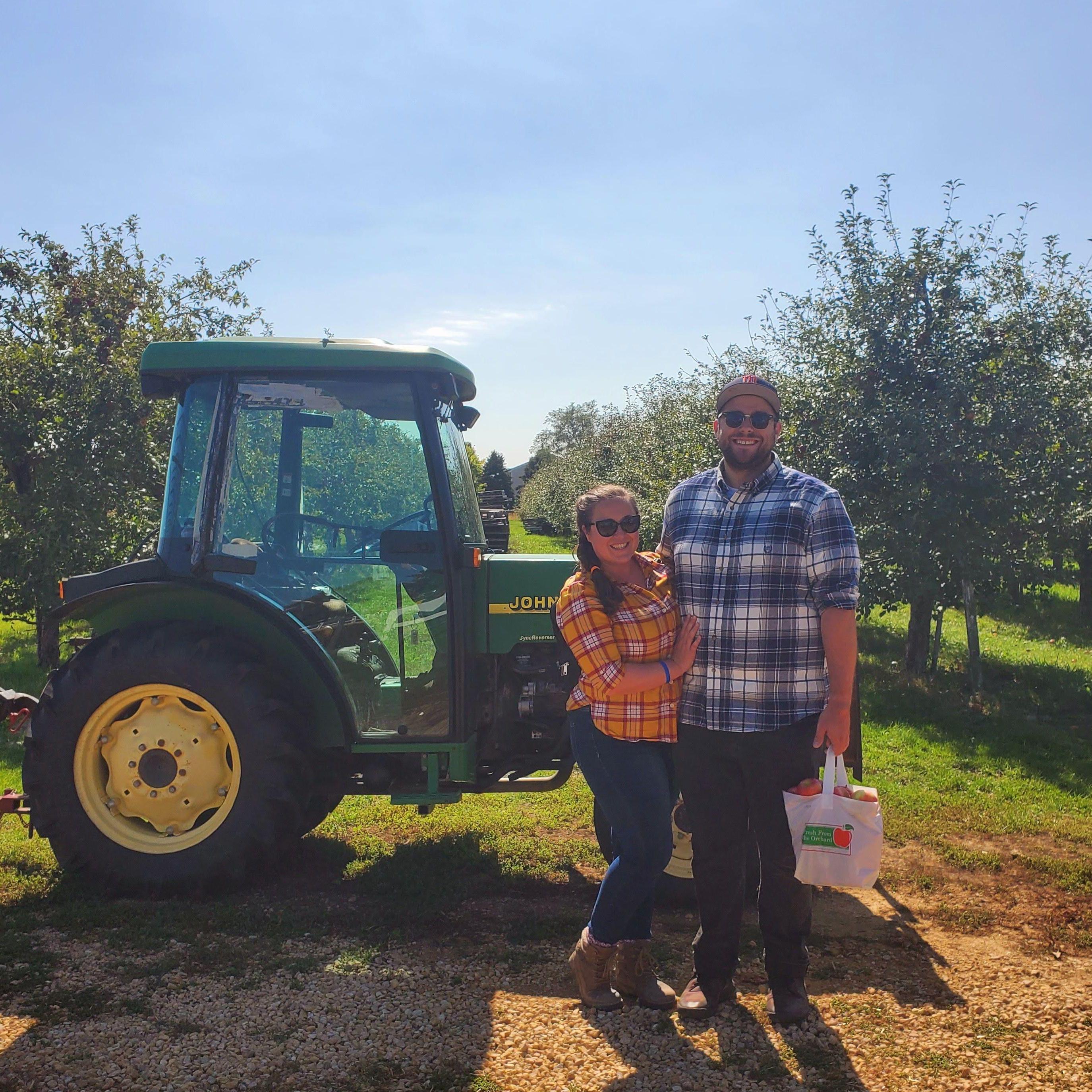Apple Picking 2021

Alt Text: Maeghan and Keiran at an apple orchard in front of a tractor, both wearing flannel, Keiran holding a bag of apples