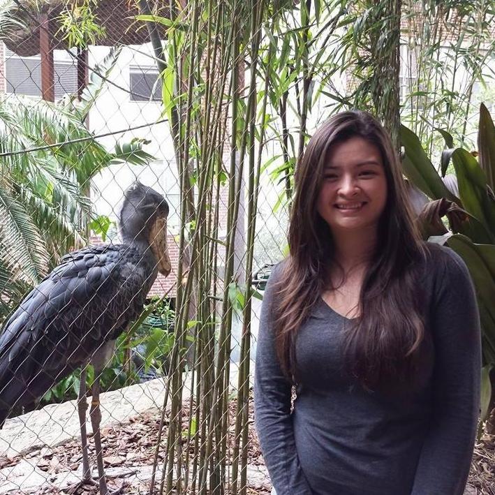 Her at the Dallas World Aquarium next to a bird of some kind.