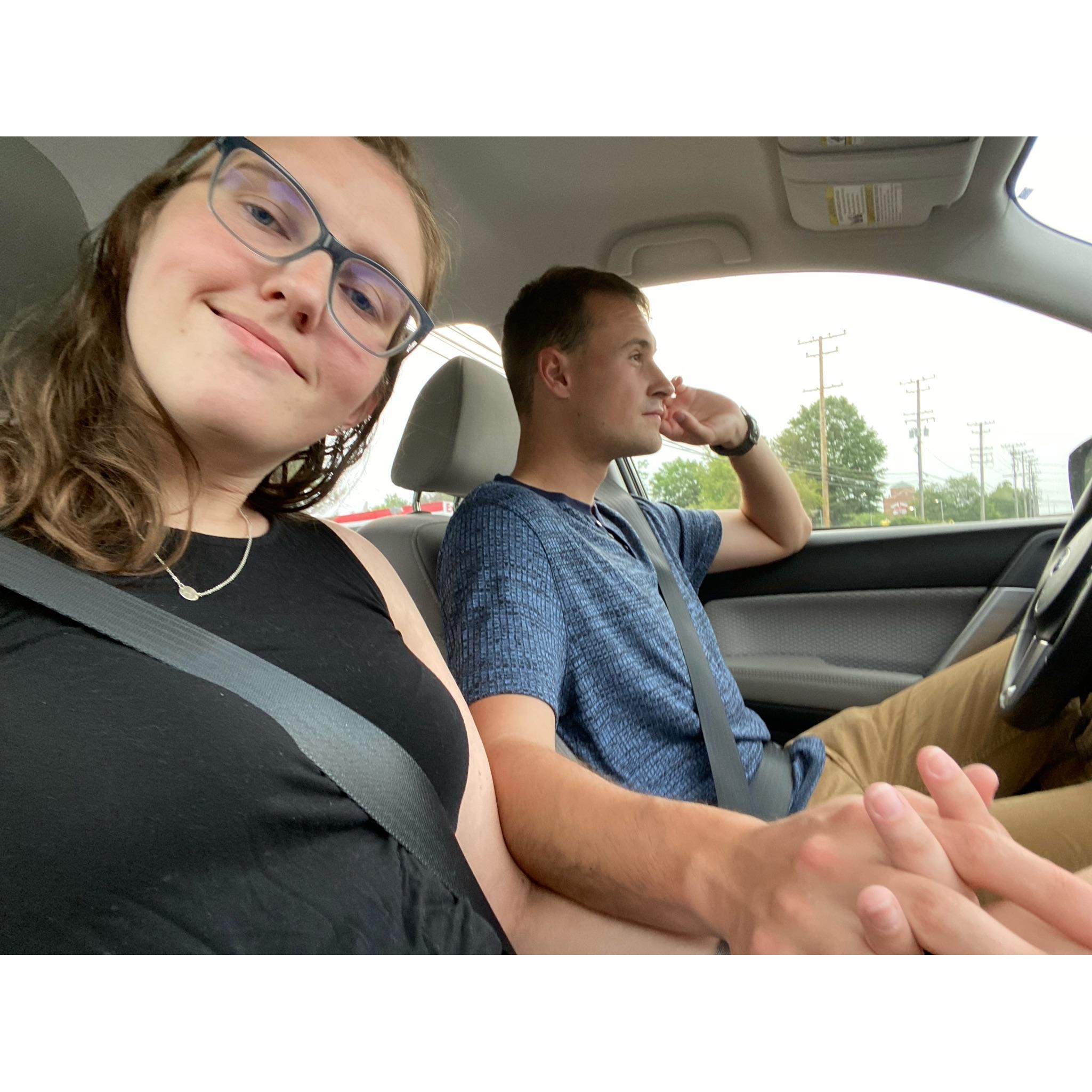 At a red light (I always drive with 2 hands on the wheel)