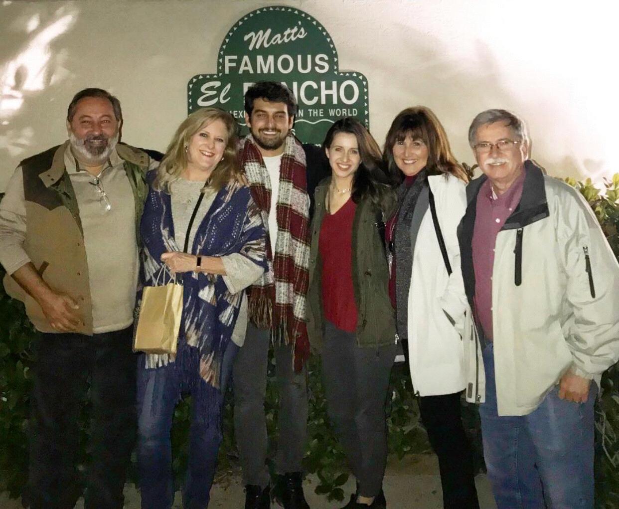 The couple with both sets of parents at beloved Matt’s El Rancho, where Tyler’s family has had dinner and drinks weekly for decades