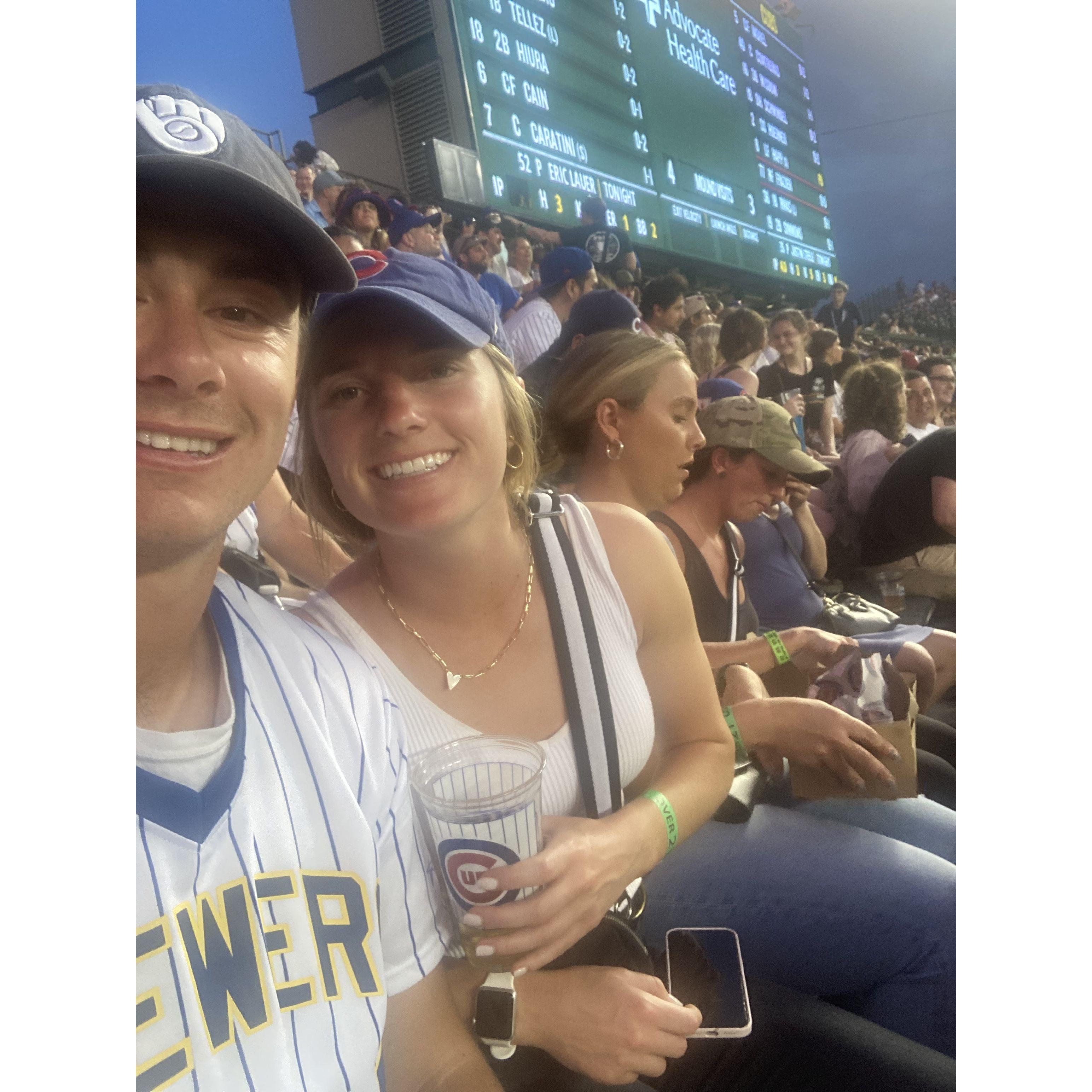 Picture in the Wrigley Field Bleachers w/ Deeana and Emily in the back about to devour some Wrigley Dogs