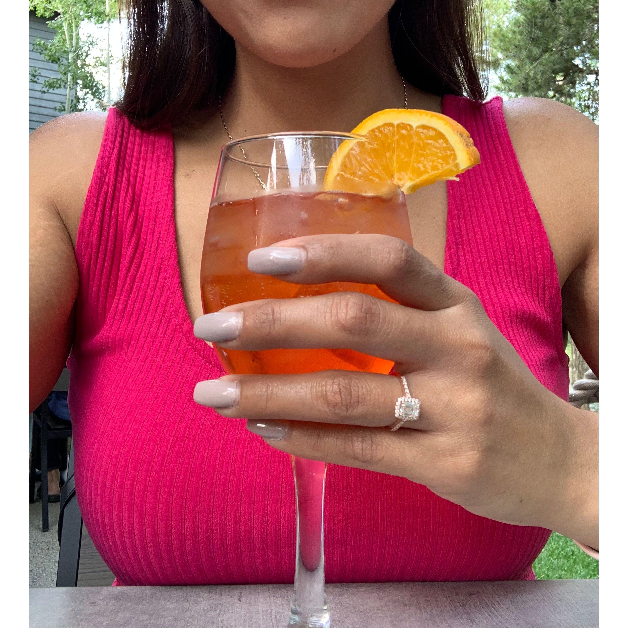 Nancy seen holding an Aperol Spritz with her new ring