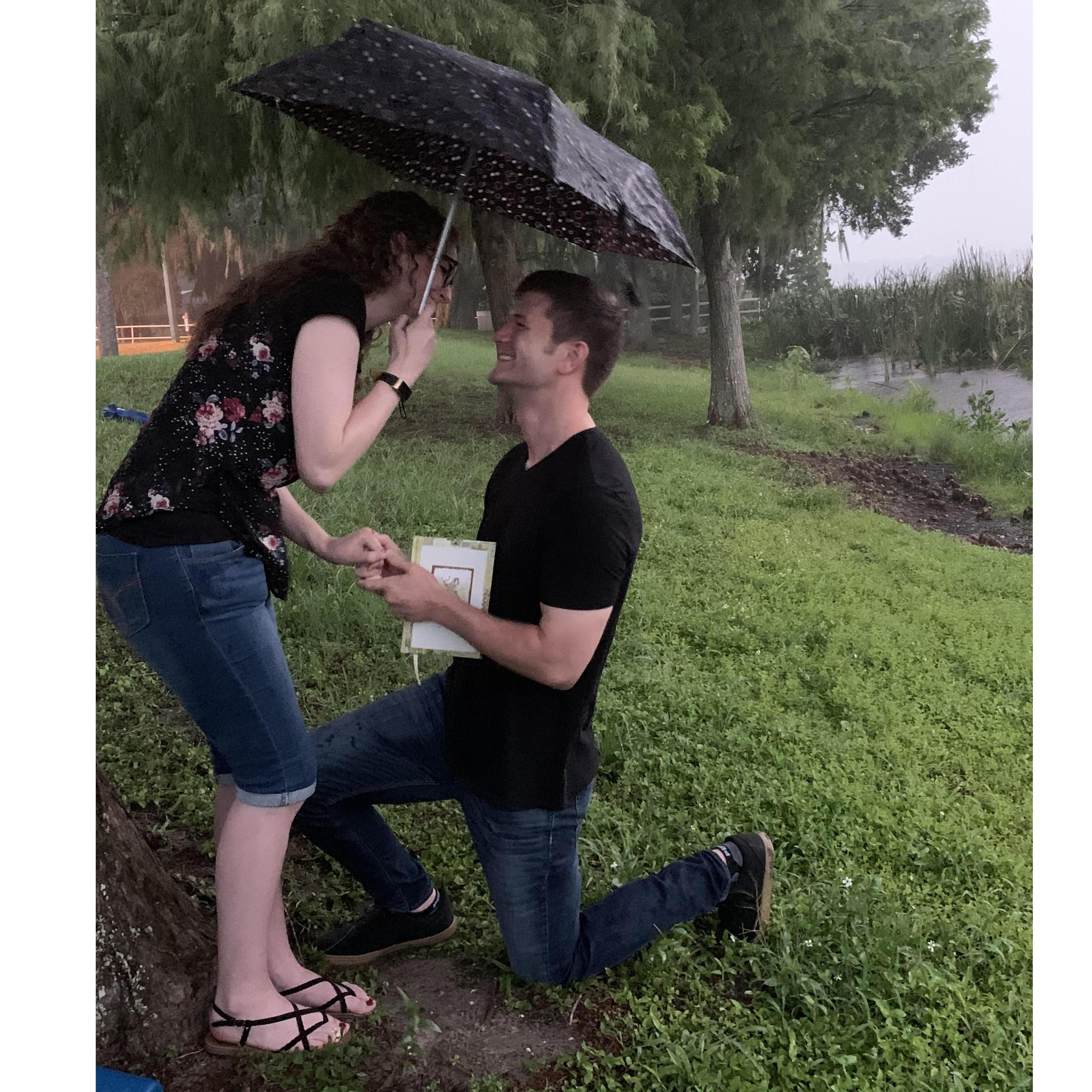 After reading our memories, he got down on one knee in the mud and pouring rain and asked me to be his wife. I said "Yes!"