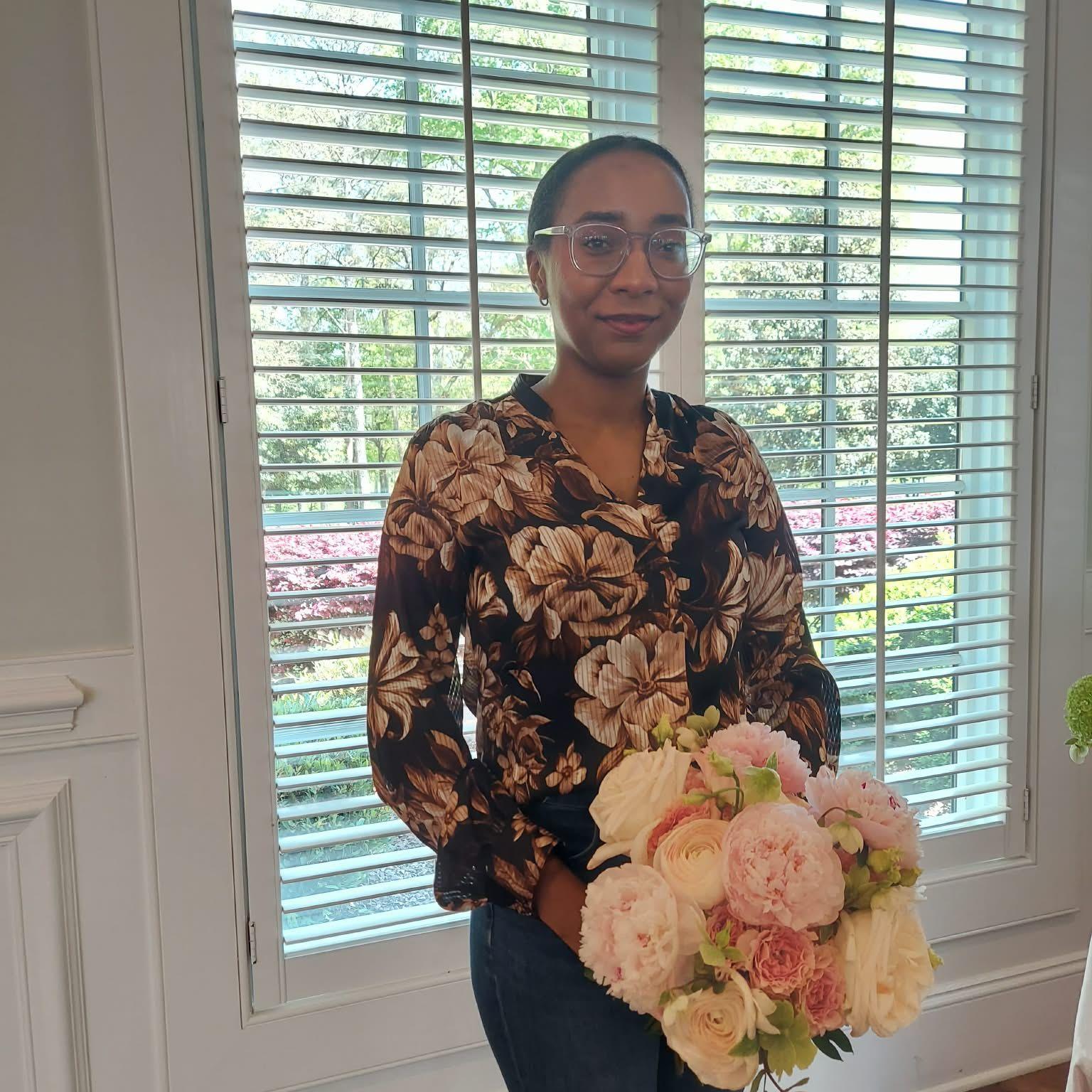 Shana with bridal bouquets at a Venue Open house