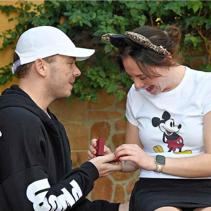 When Mac proposed to me at Epcot during our family photo session.