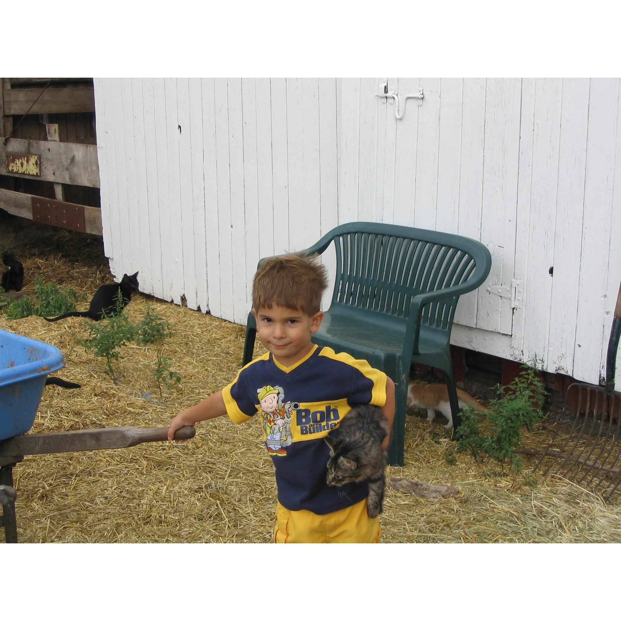 Baby matt on the farm, this is where I believe his love for cats developed.