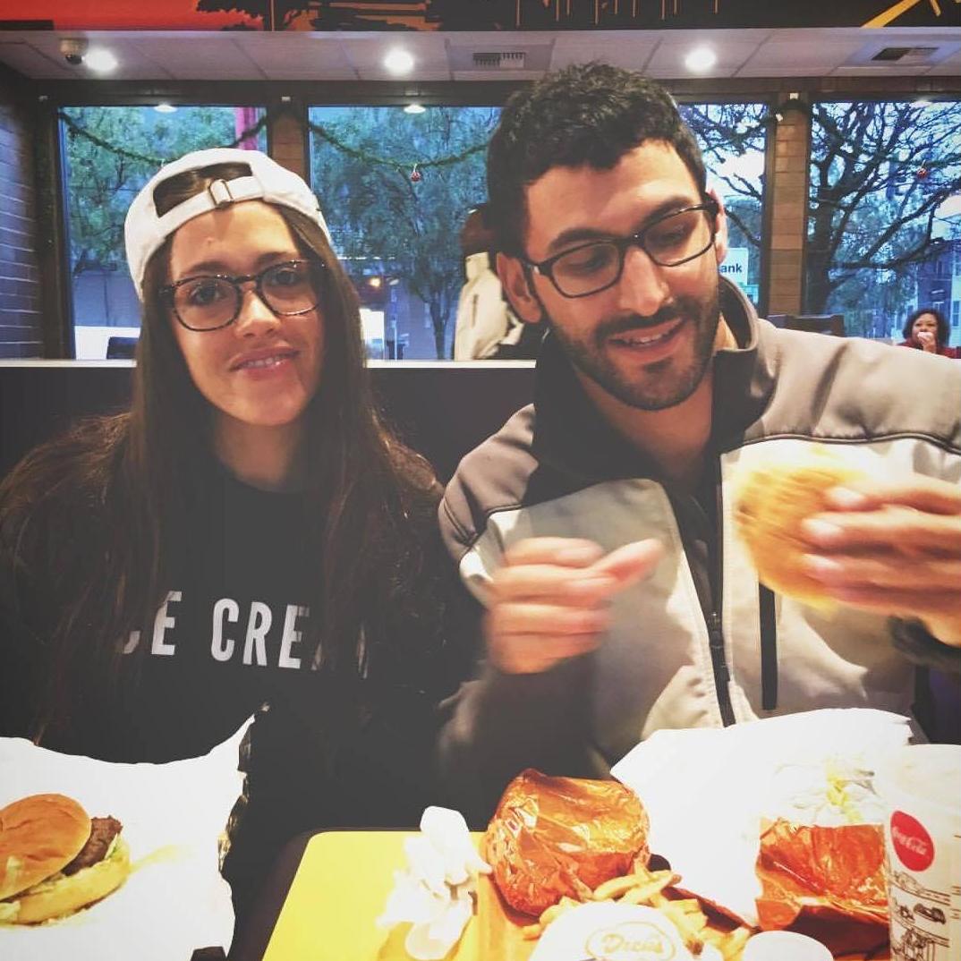 Sharing a favorite meal: burgers and fries.