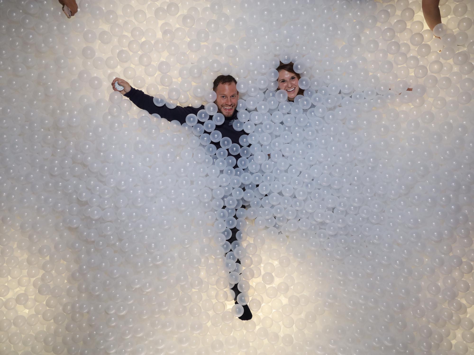A giant adult-sized ball pit is more fun than we could ever explain... and also a bigger leg workout than you would imagine.
