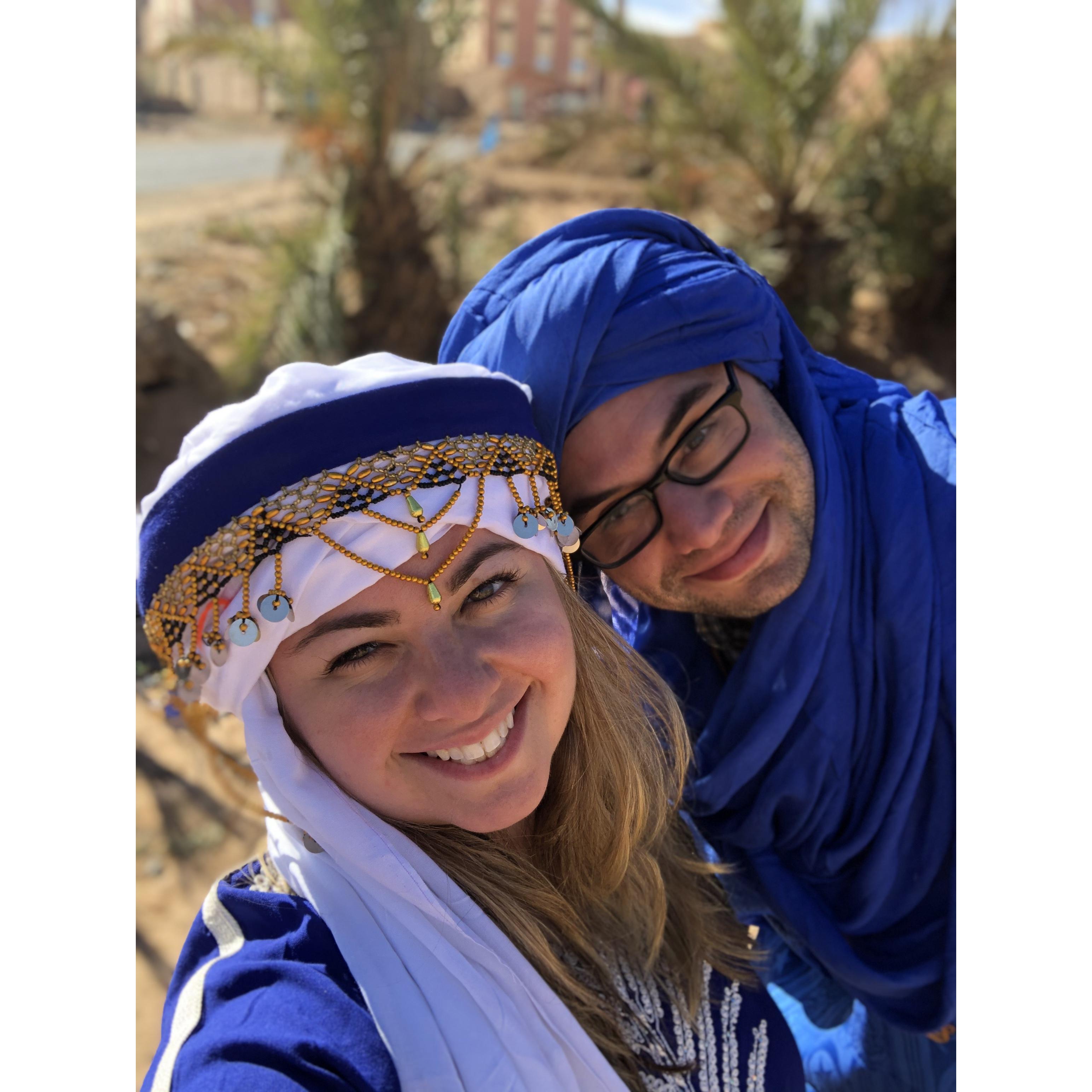 Trying on Bedouin gear in Merzouga, Morocco