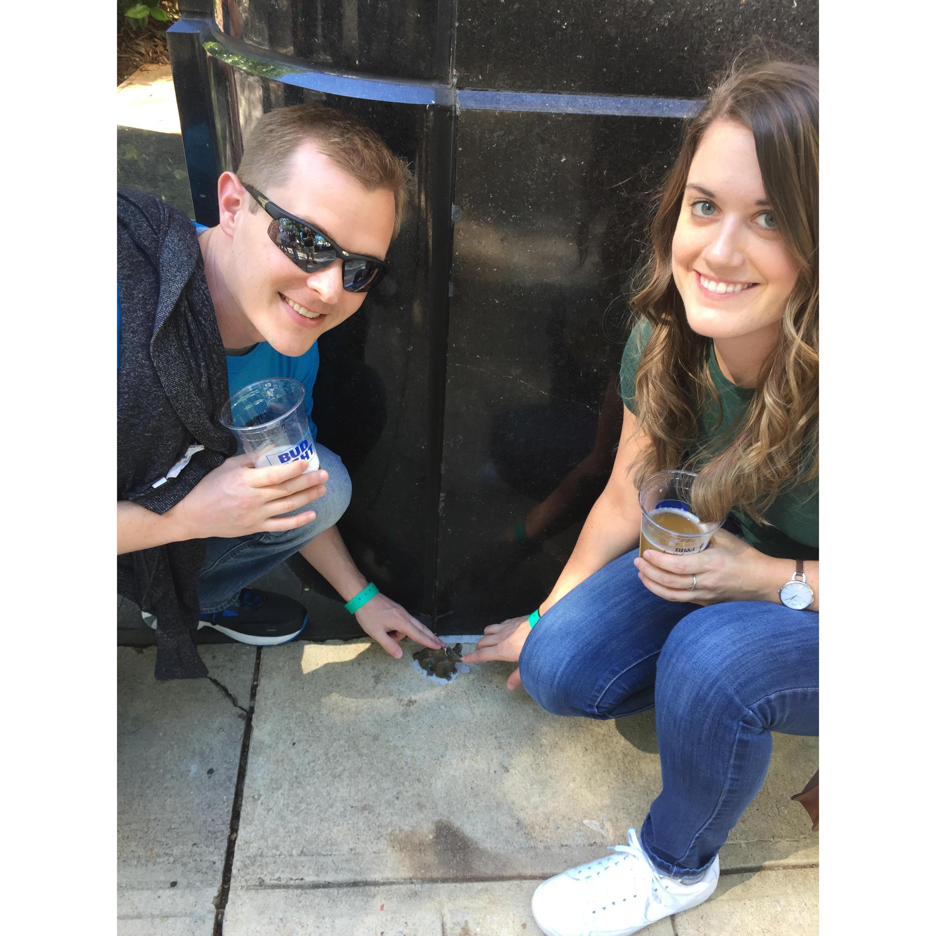 Petting one of the secret mouse statues in Greenville