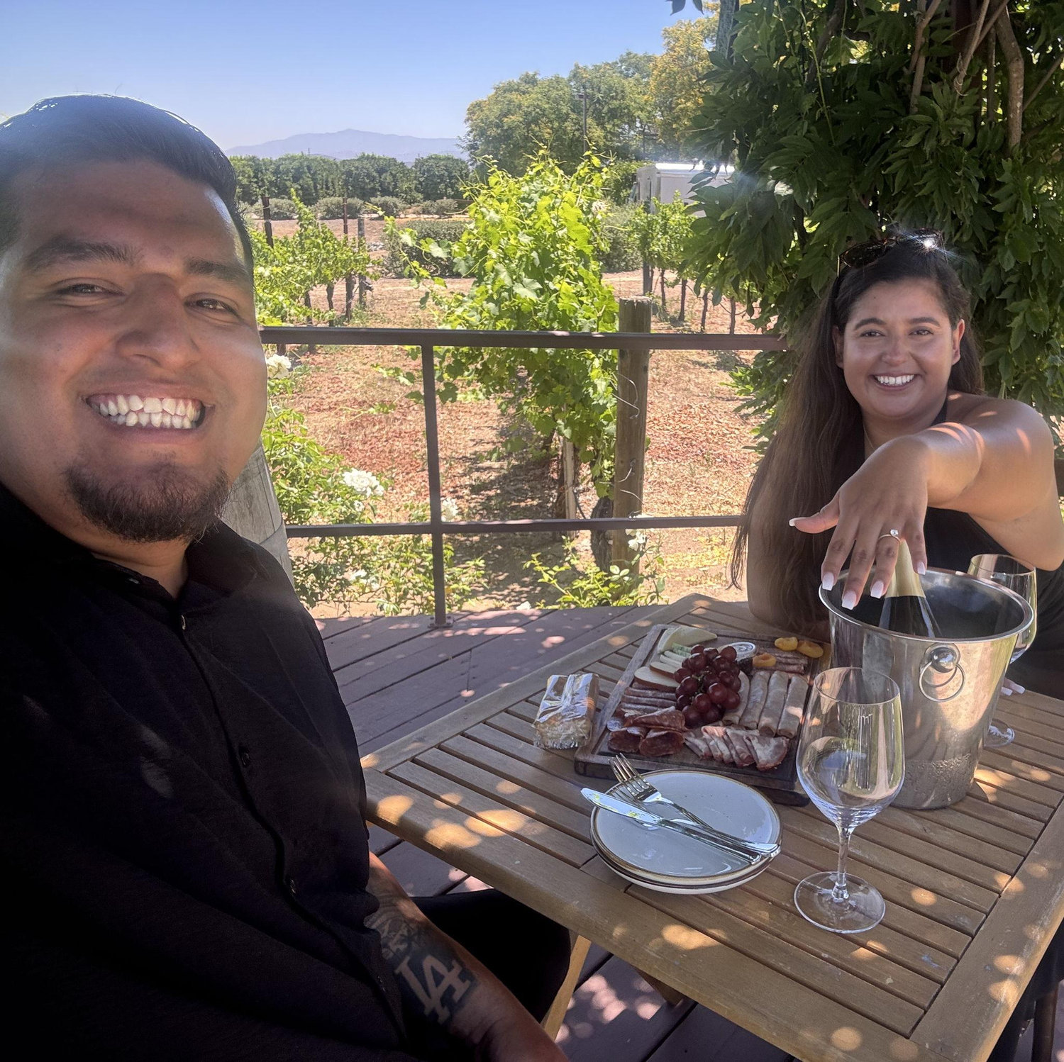 Our celebratory photo after Steven's surprise proposal at Lorimar Winery surrounded by family & friends. July 2025.