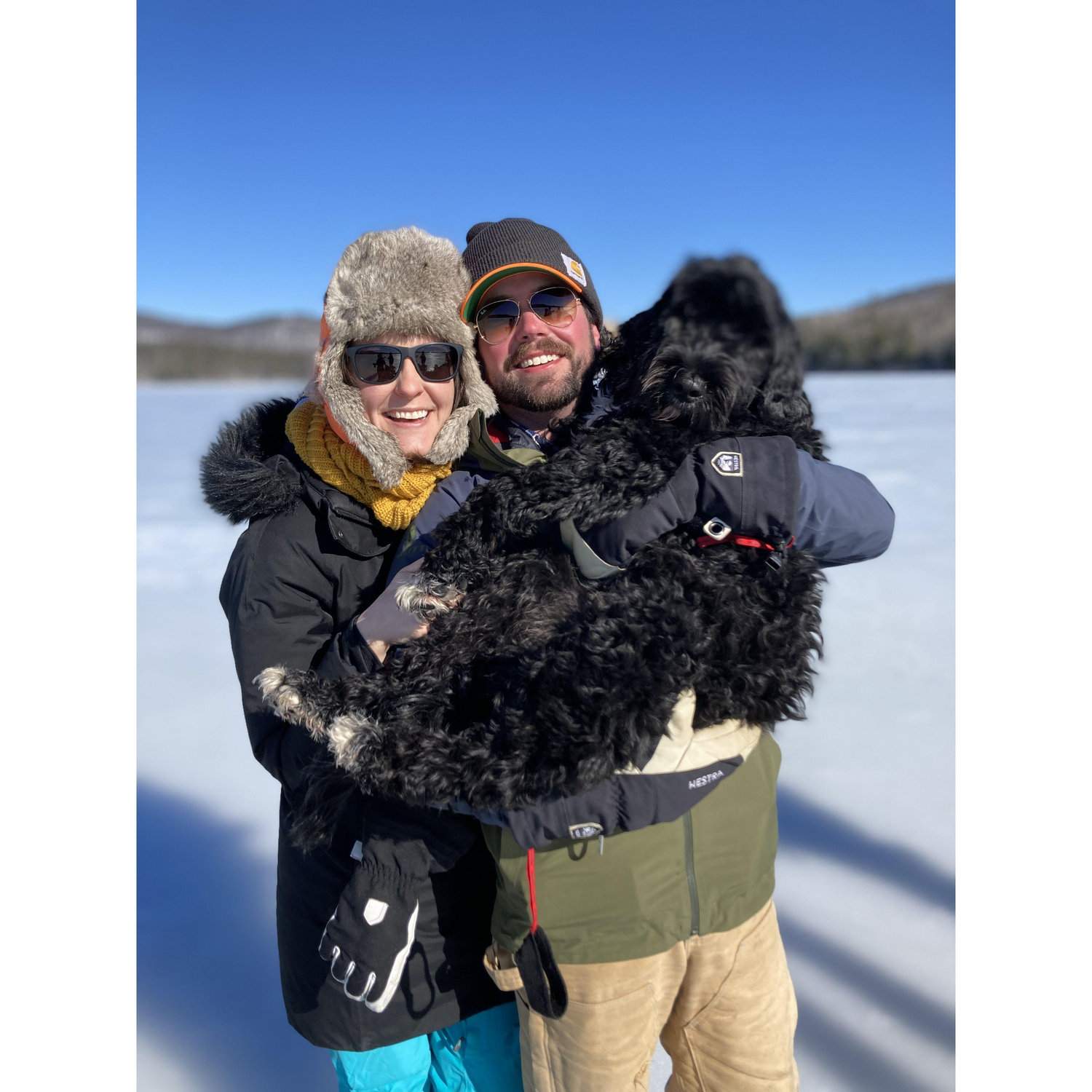 The whole family, including Hudson, ice fishing on Kezar Lake in Maine.