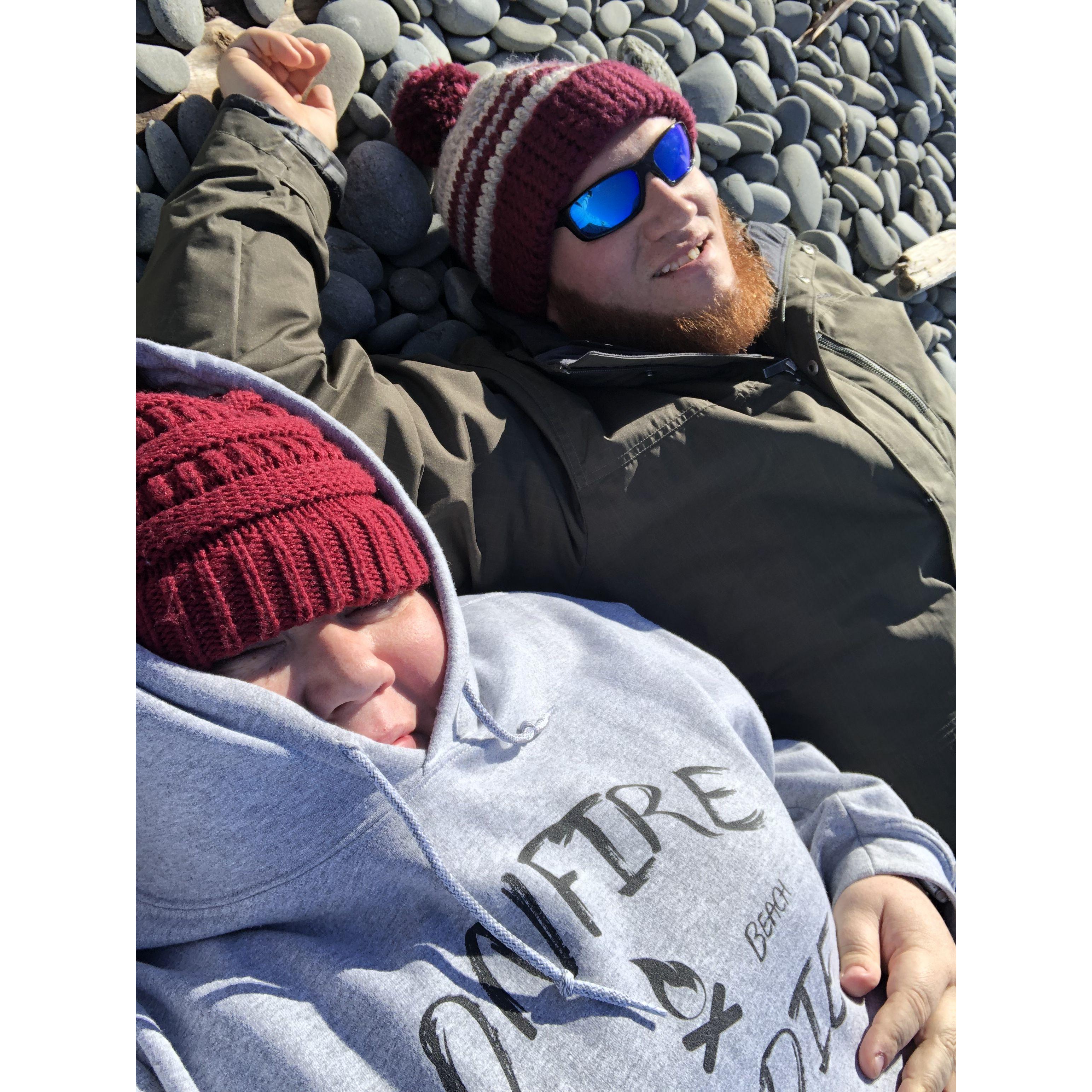 Ashley & Josh on the beach of the Pacific Ocean on the rocky coast of Washington in 2019