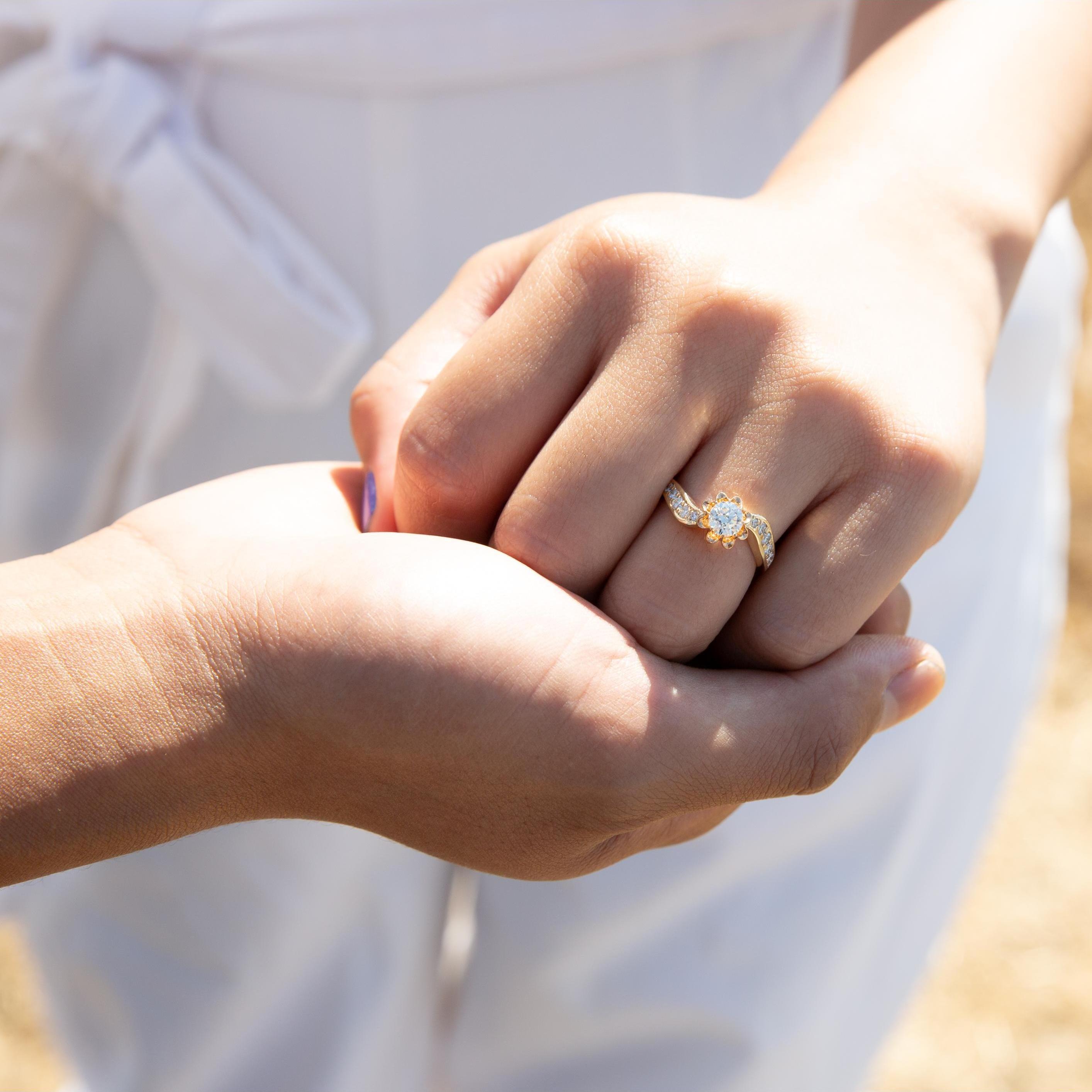 September 26, 2021.  To be flanked by cuts of jade on the wedding band, the diamond and scallop of her engagement ring are from her grandmother.